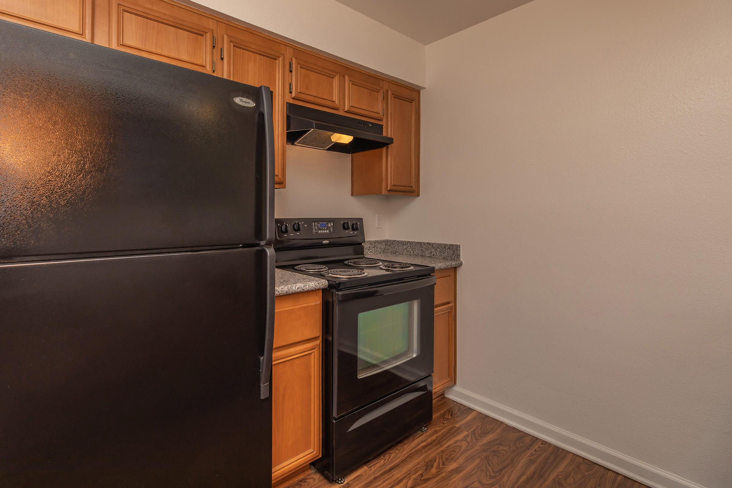 a kitchen with a stove top oven sitting inside of a refrigerator