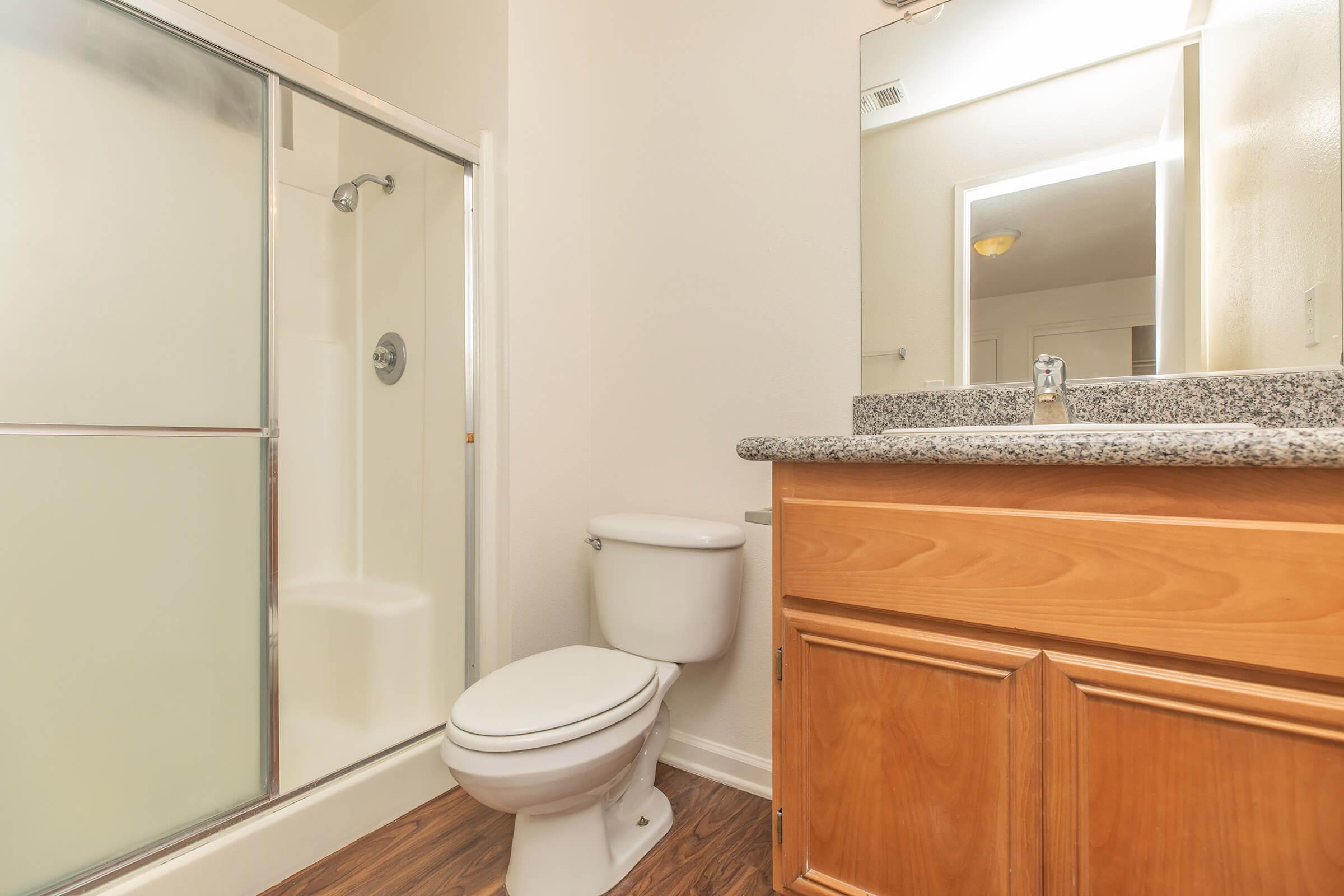 a kitchen with a sink and a mirror