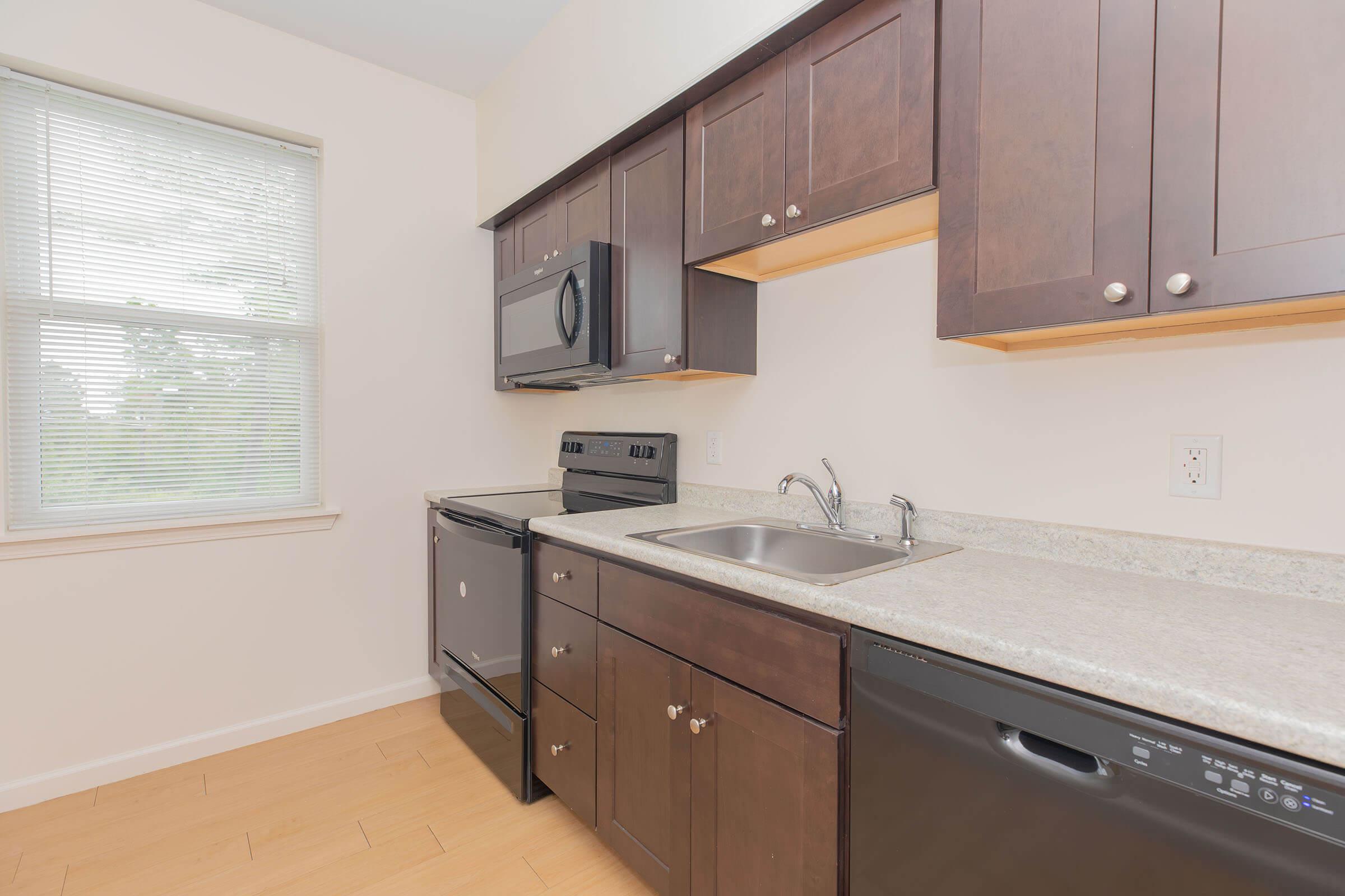 a kitchen with a sink and a window