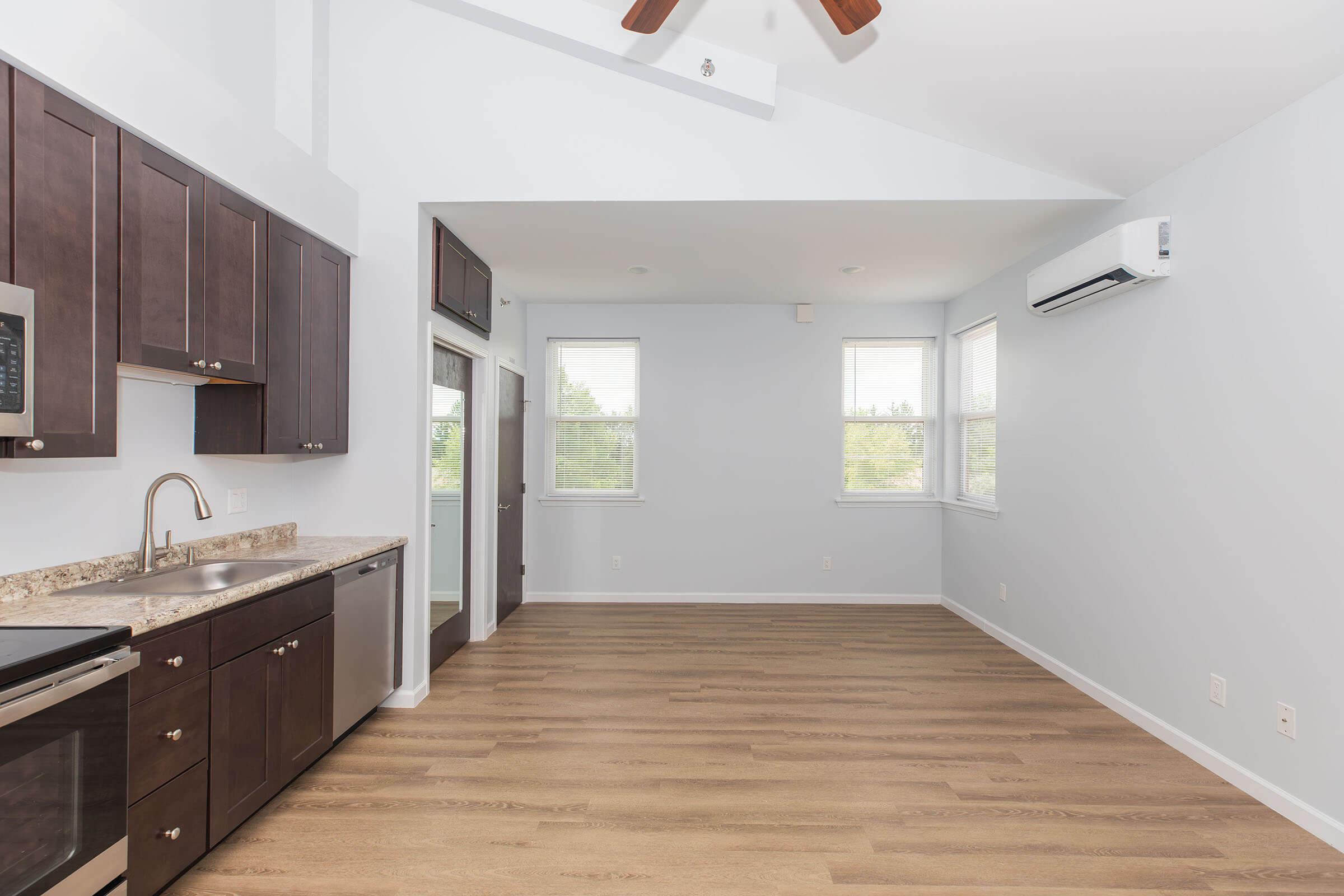 a kitchen with a wood floor