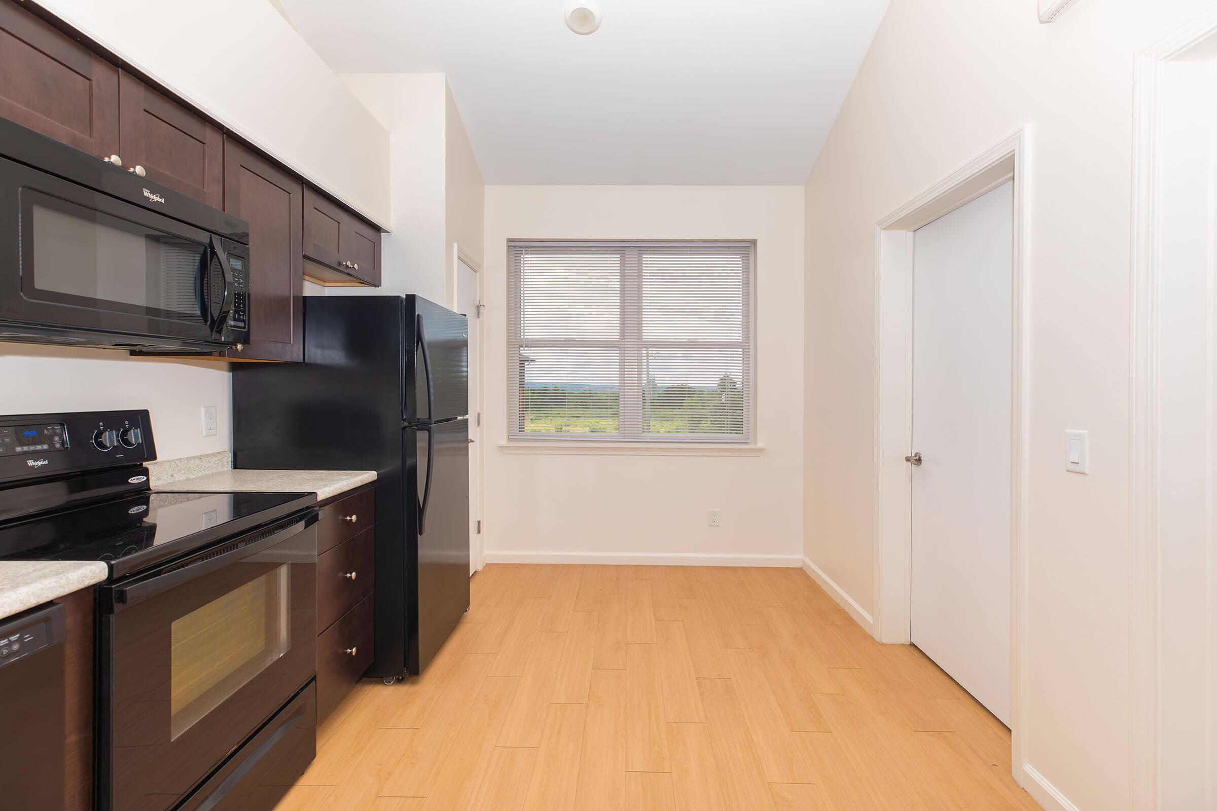 a kitchen with a stove top oven