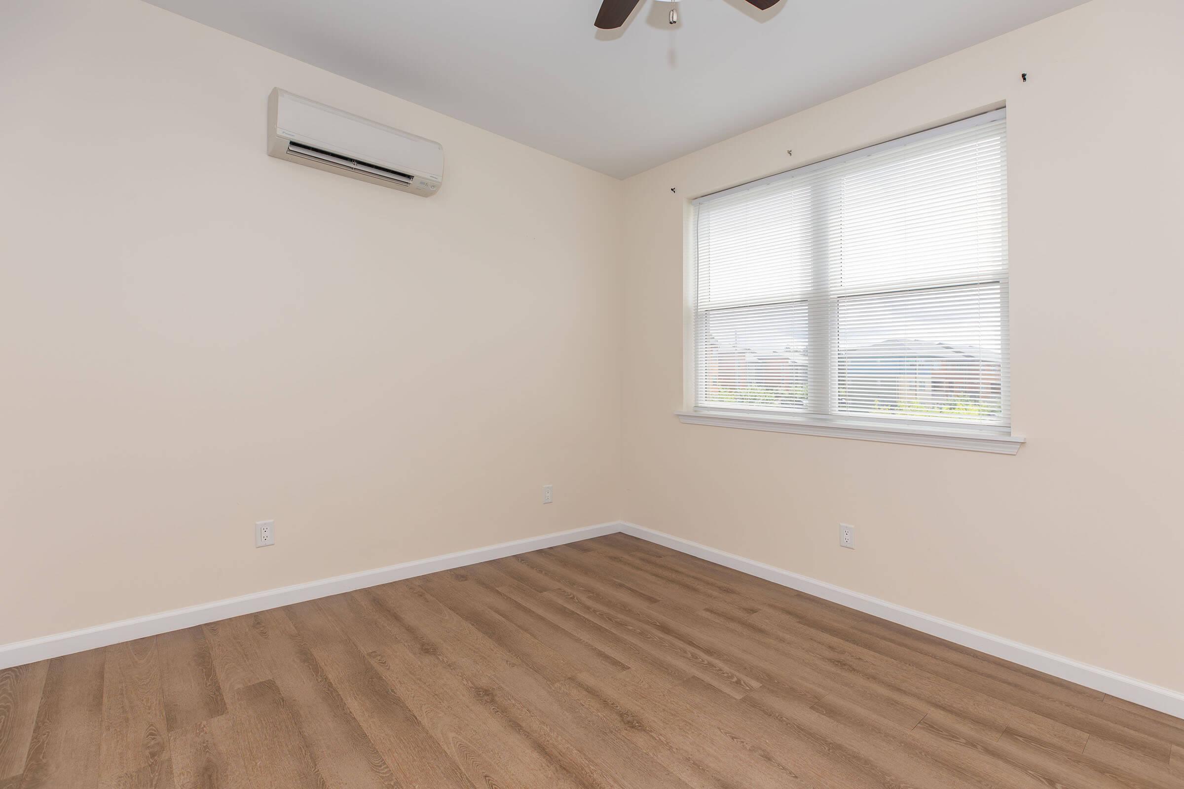 a bedroom with a large window