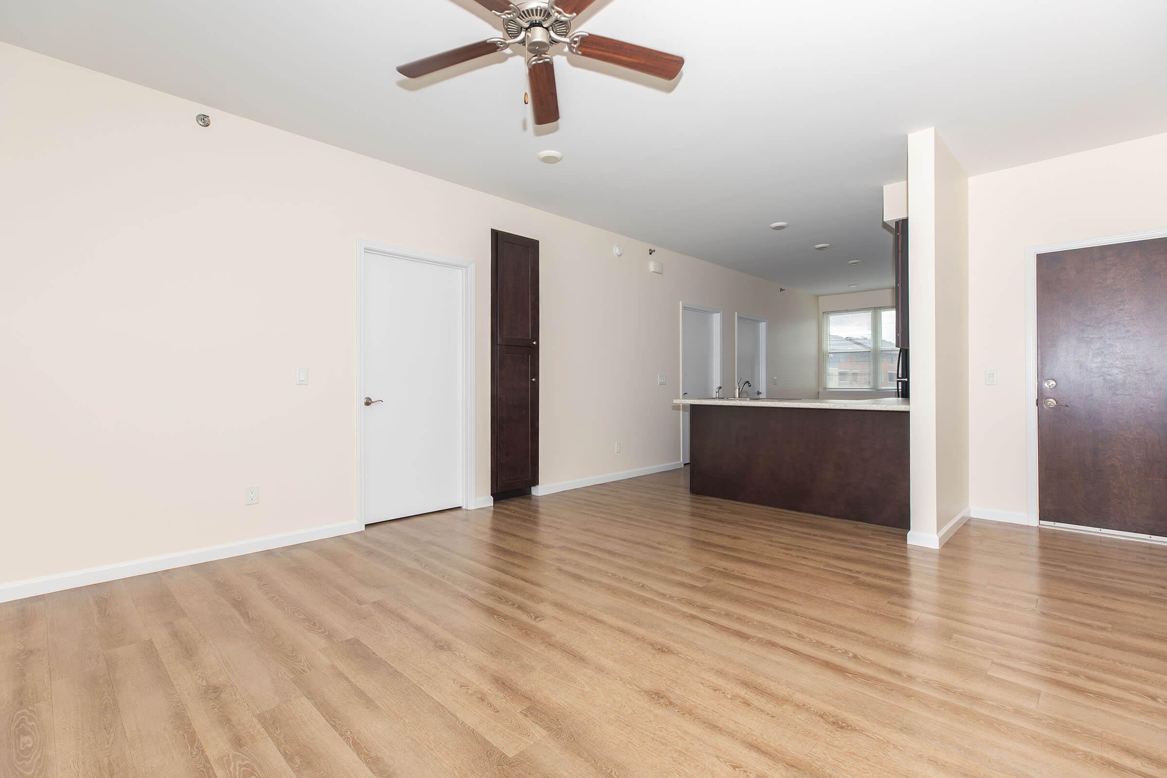 a large empty room with a wood floor