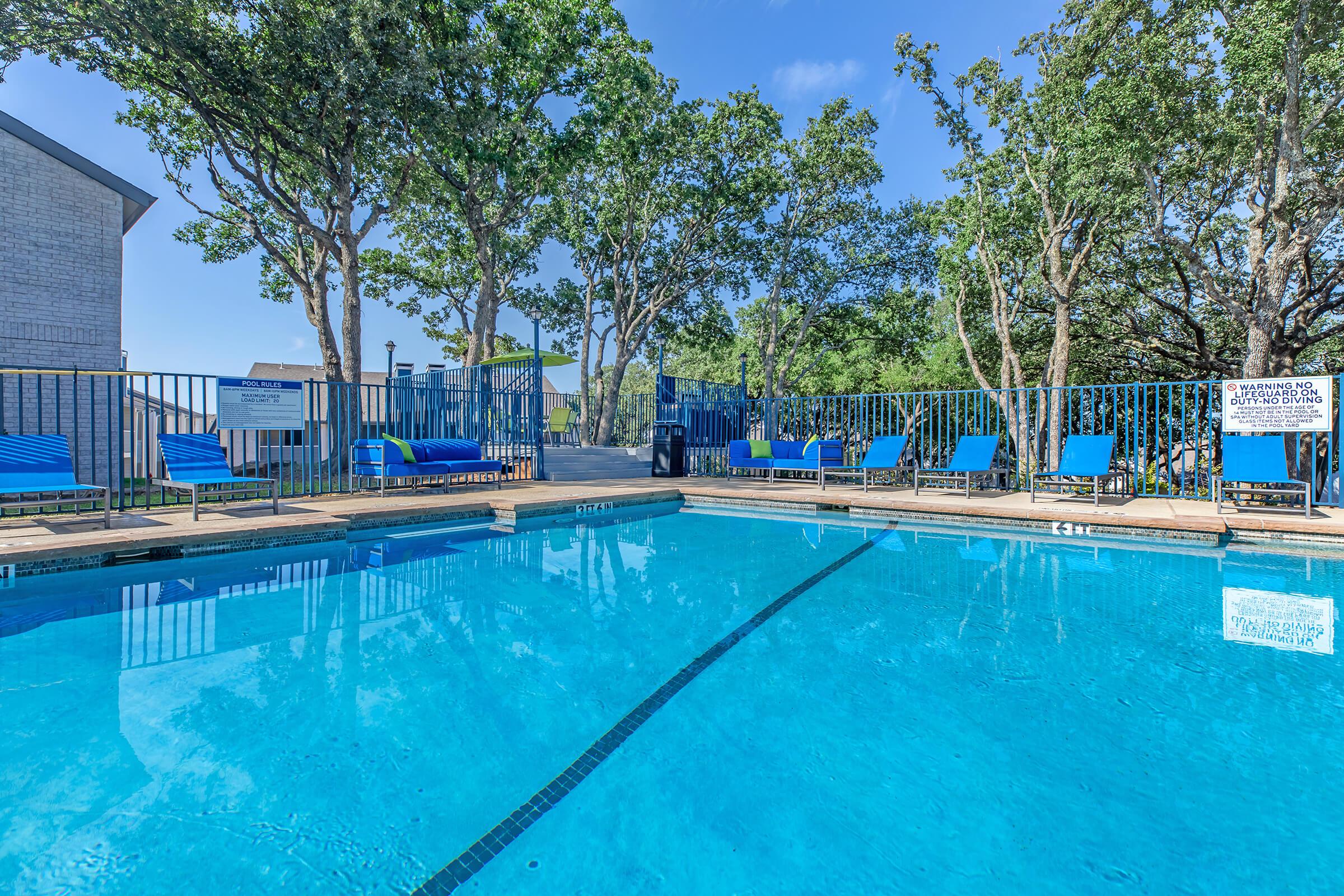 Large outdoor swimming pool at Bedford, TX apartment building