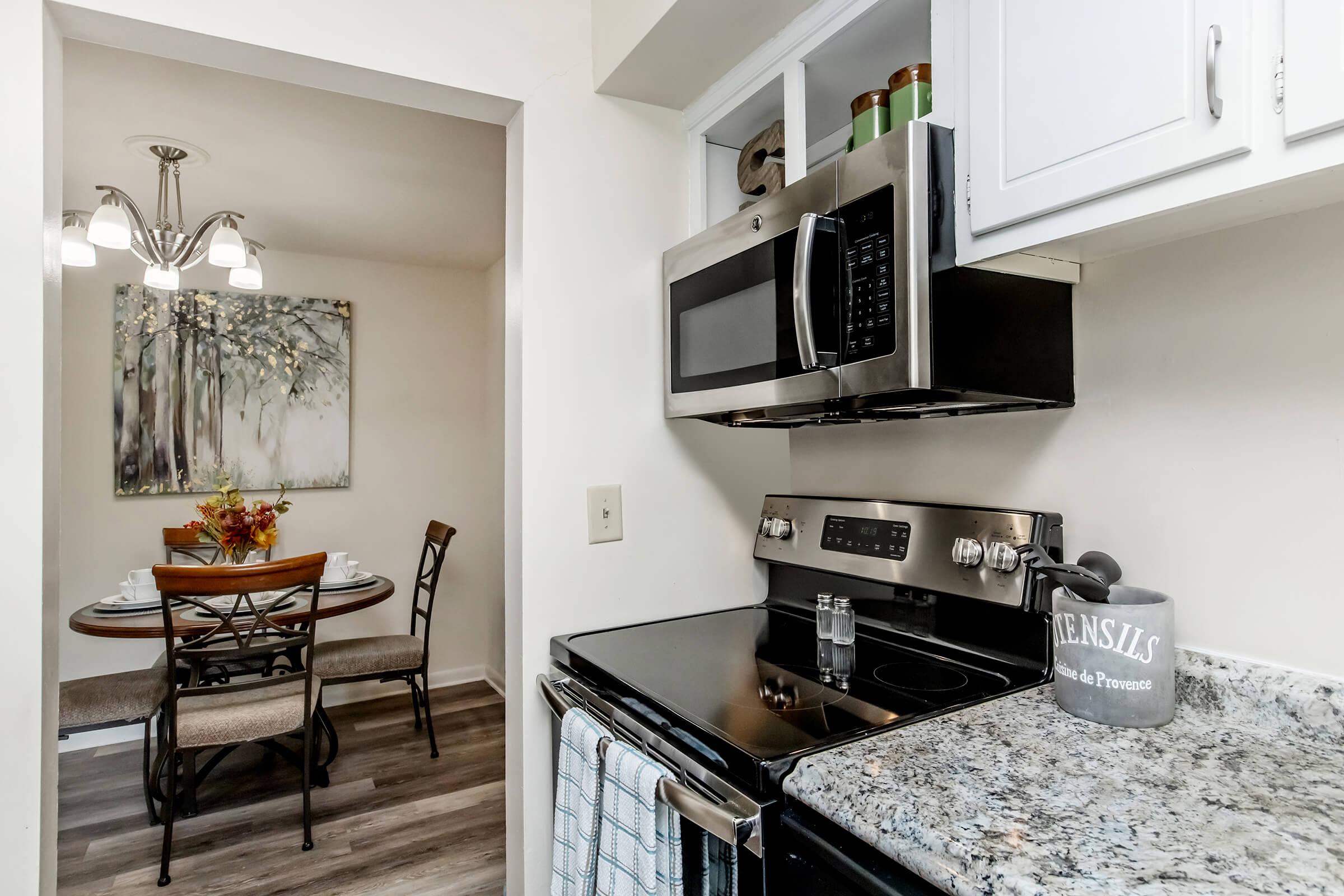 a kitchen with a table in a room