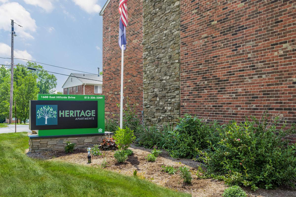 a sign on the side of a brick building