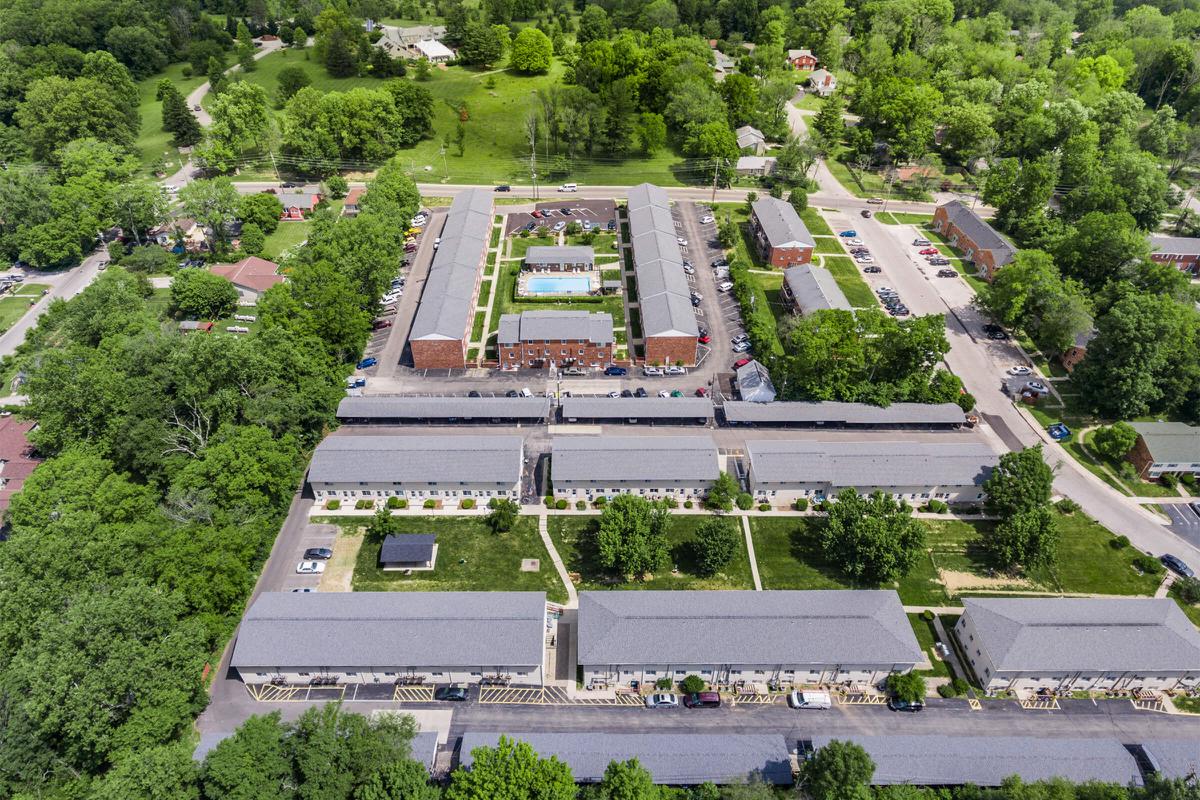 a garden with a city in the background