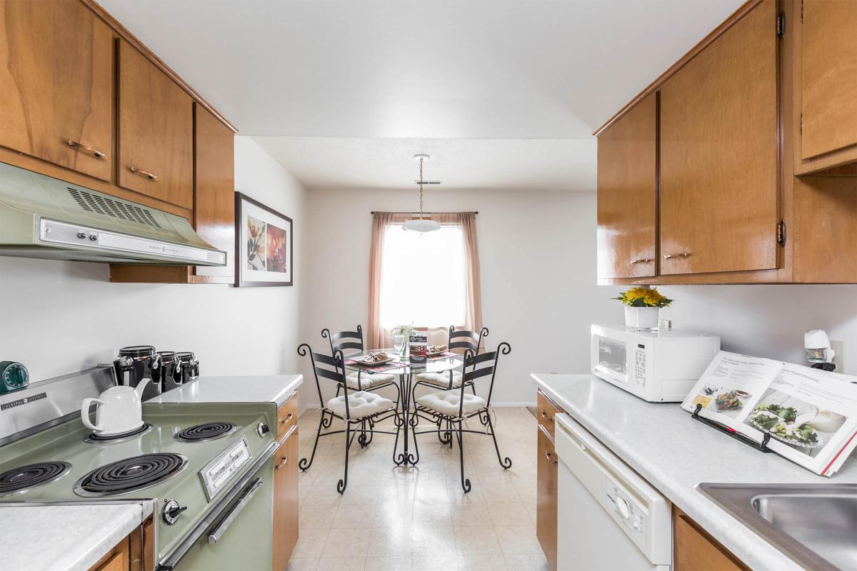 a kitchen with a stove sink and refrigerator