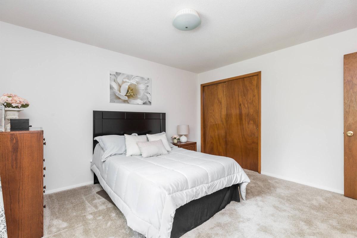 a bedroom with a large bed in a hotel room