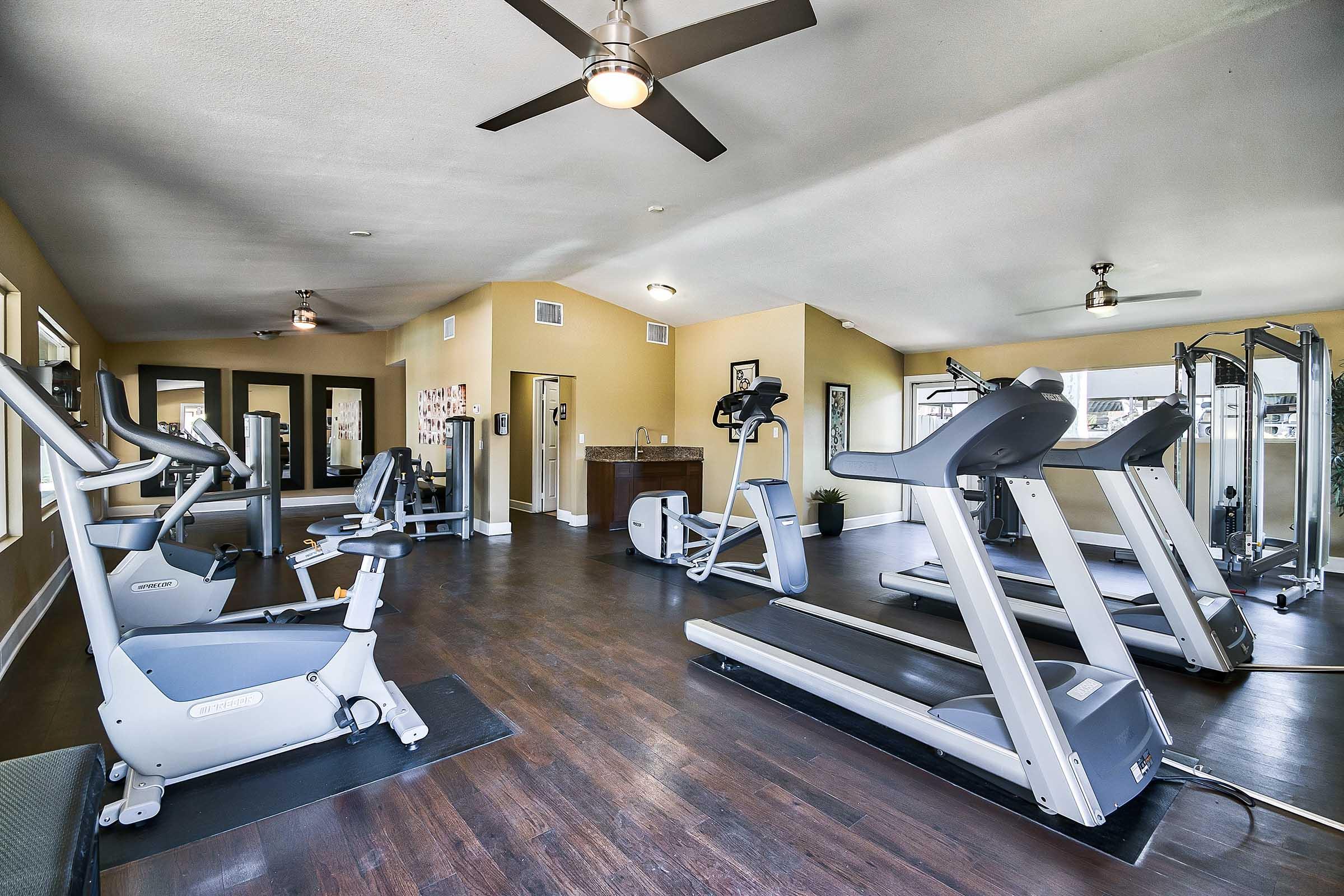 a fitness center with treadmills