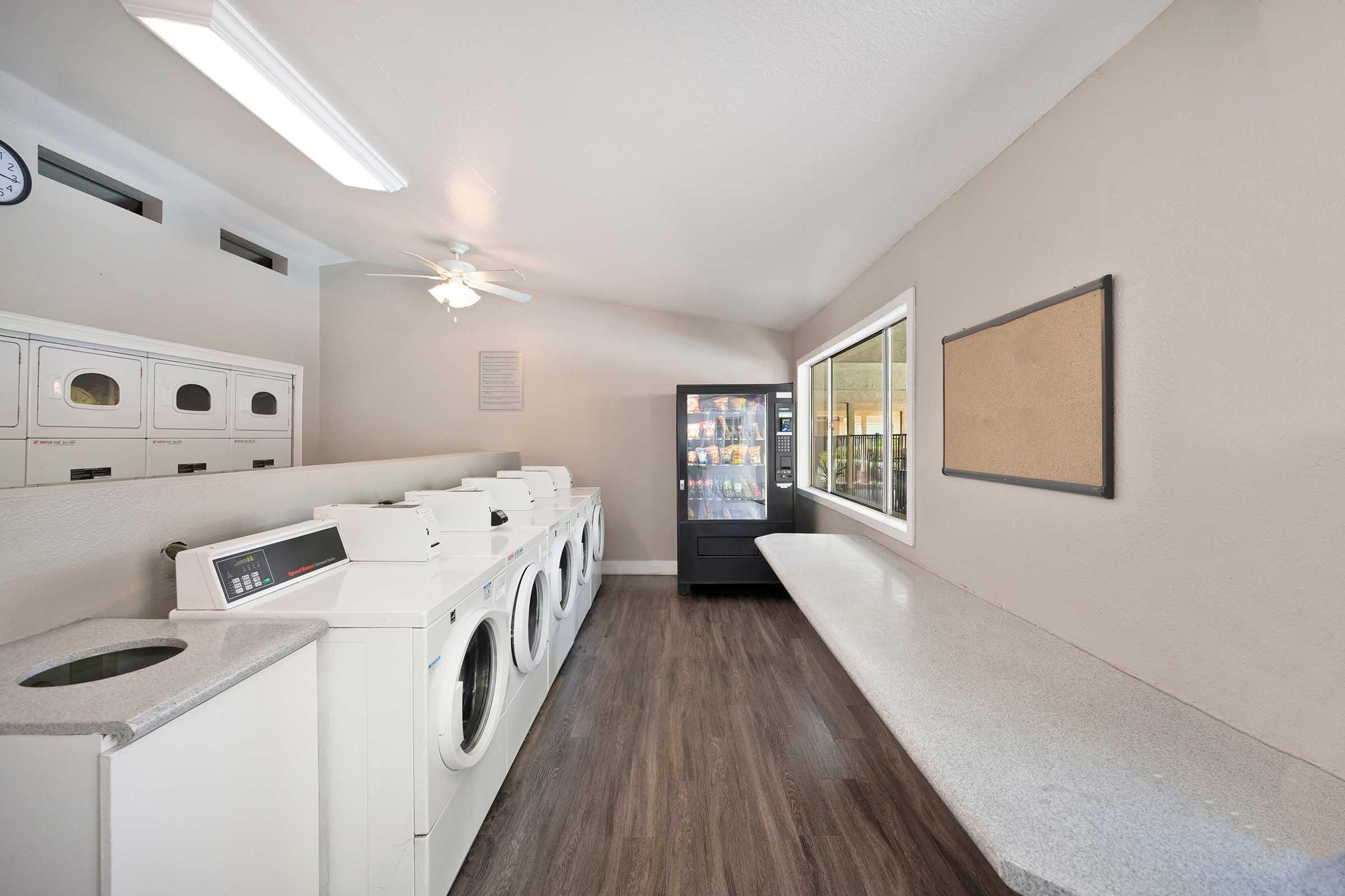 a laundry room with machines