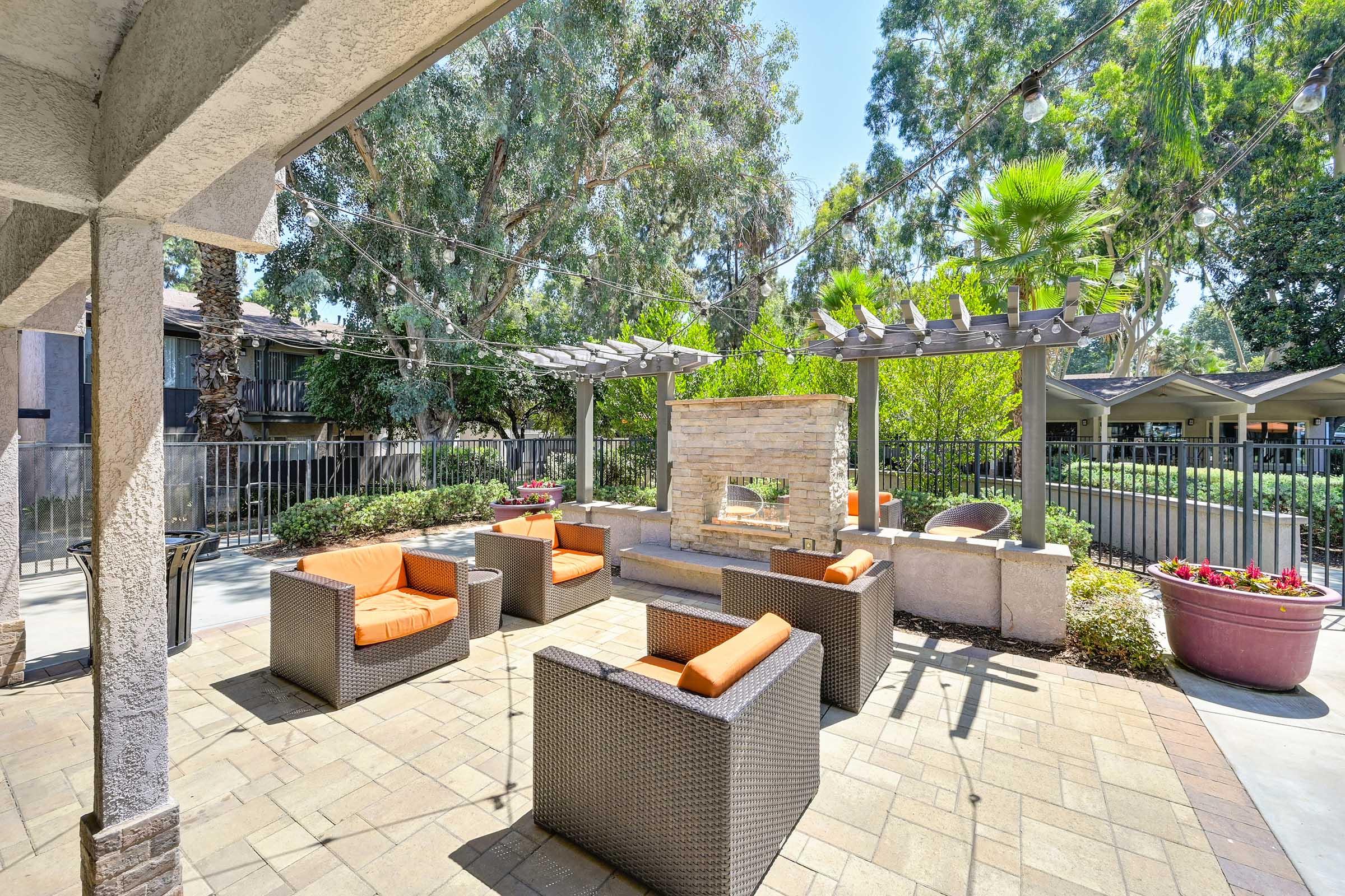 chairs around an outdoor fireplace