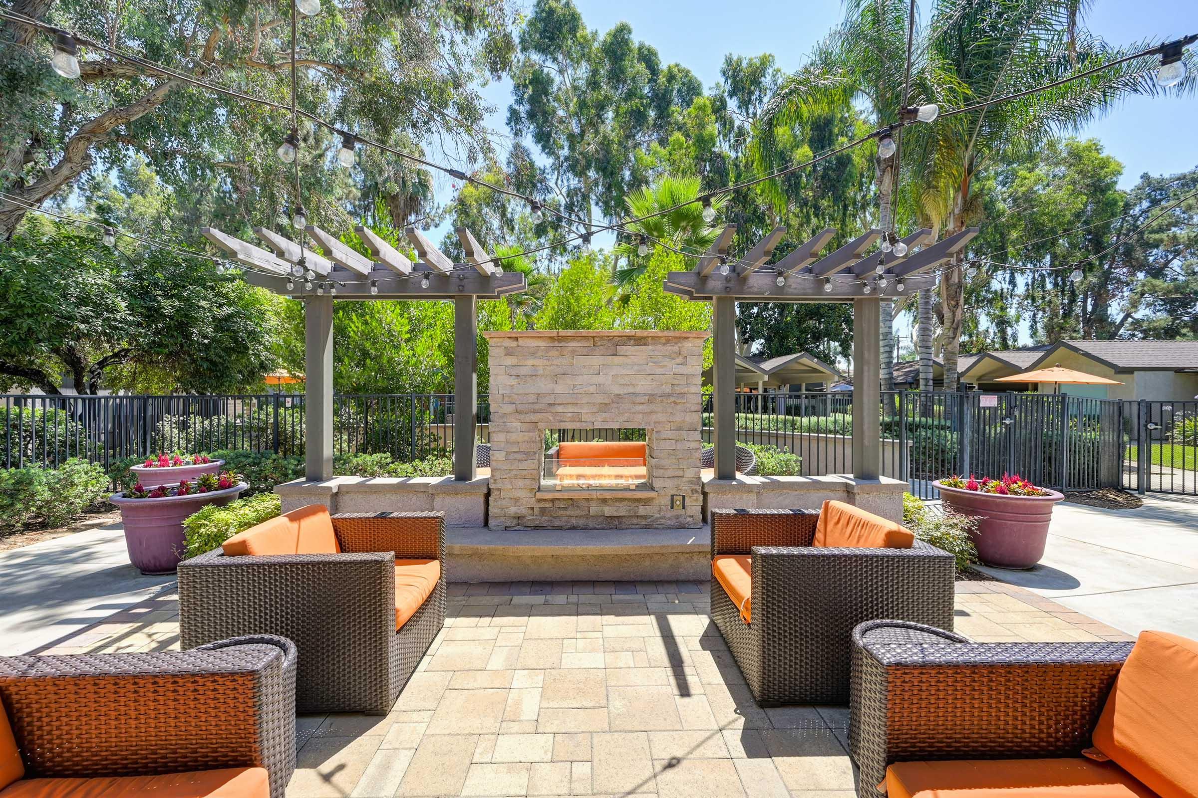 an outdoor fireplace with seating