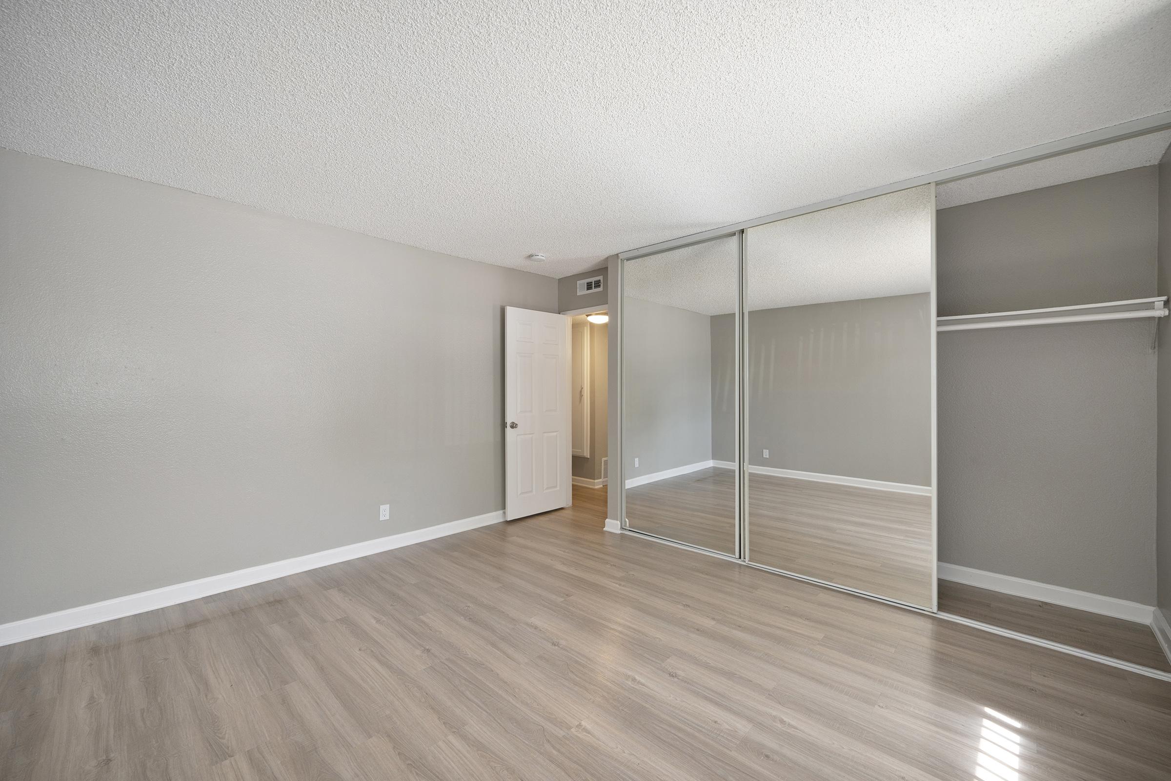 a large room with mirrored doors