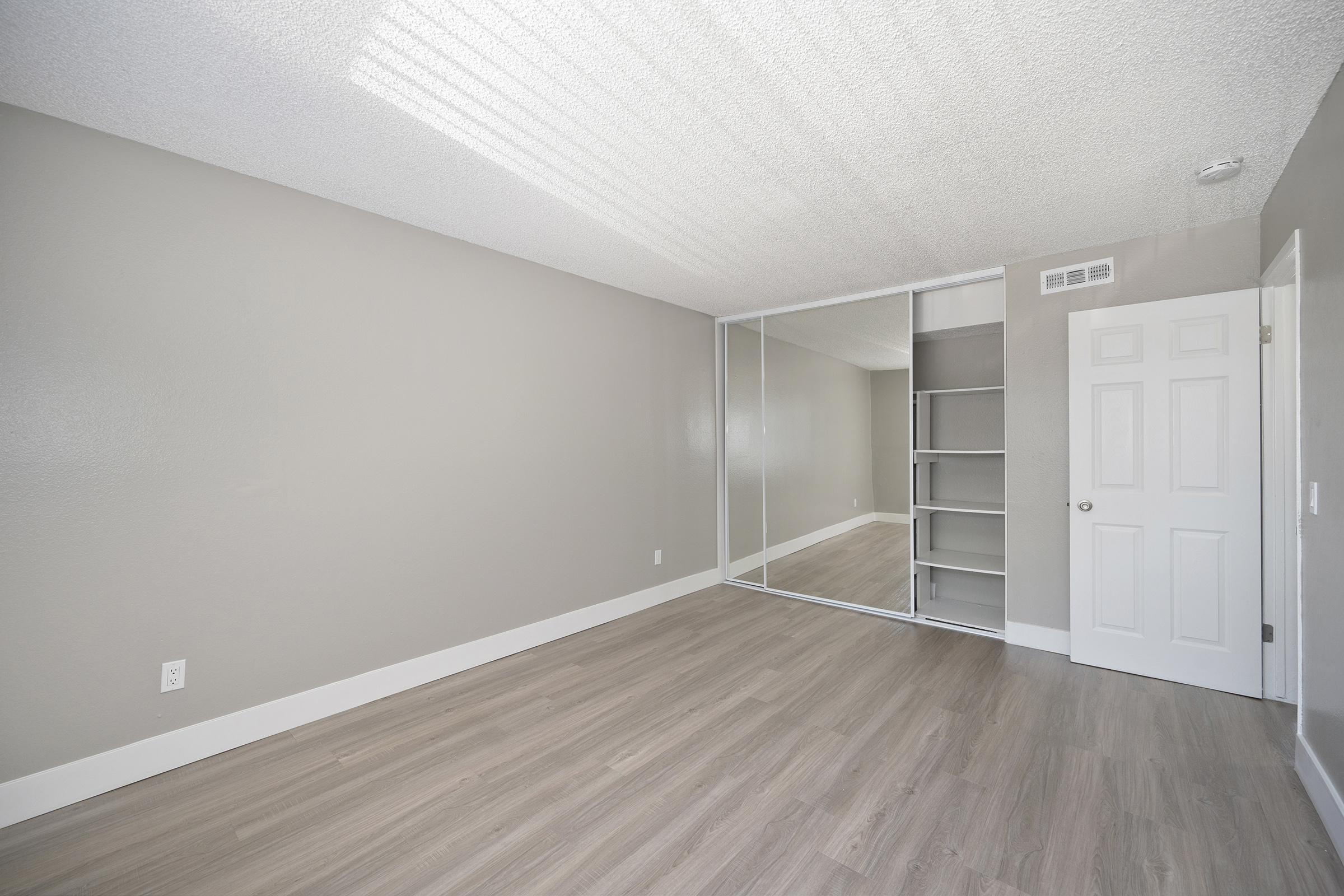 a large bedroom with closet