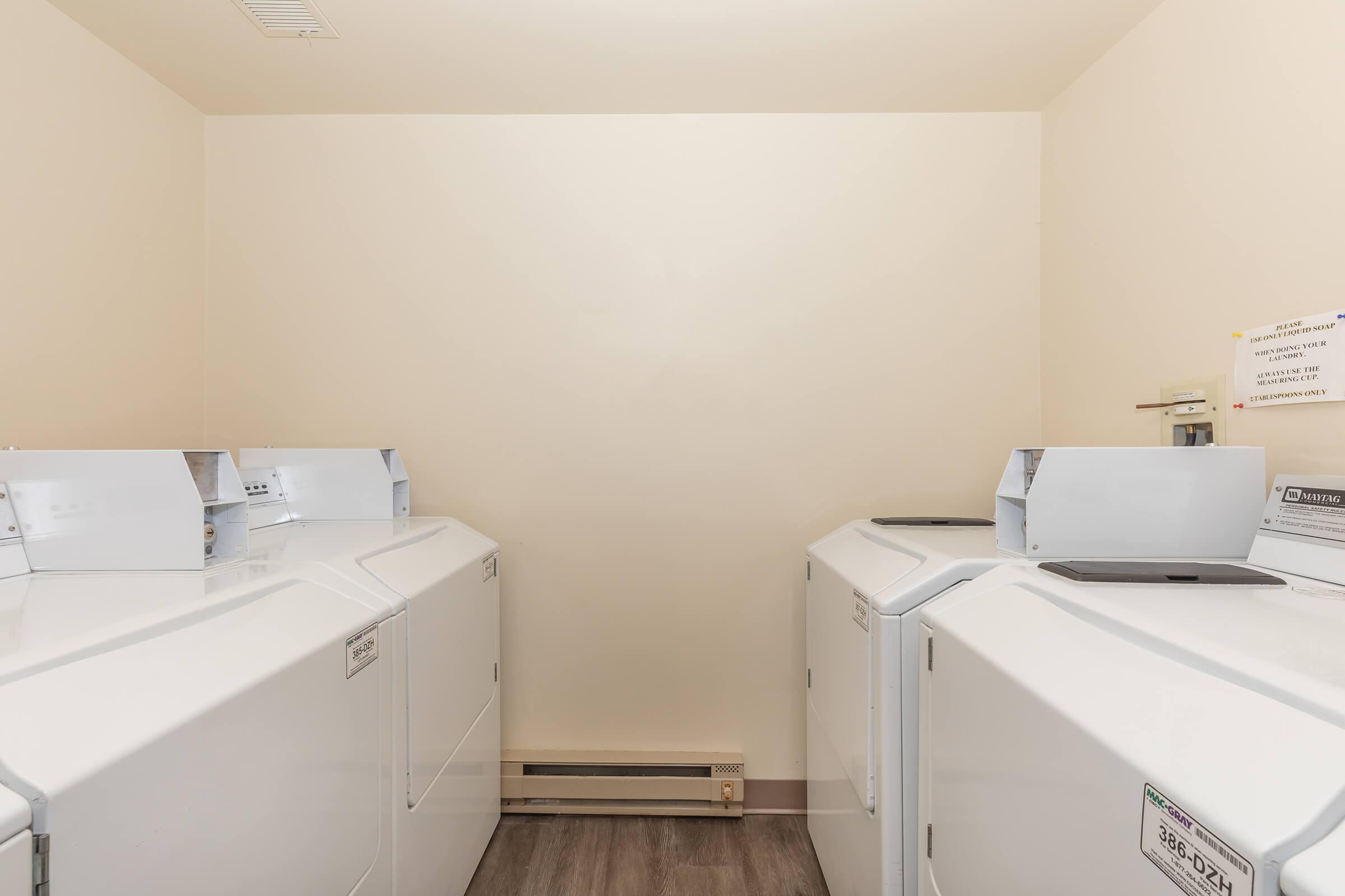 a white refrigerator freezer sitting in a room