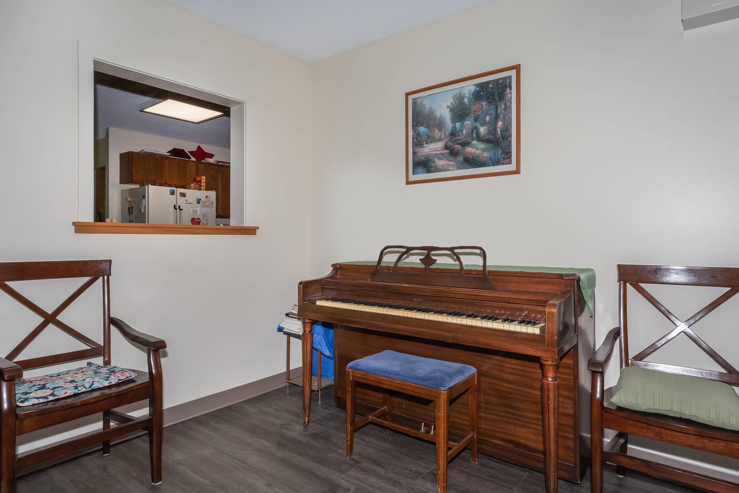 a living room filled with furniture on top of a wooden chair