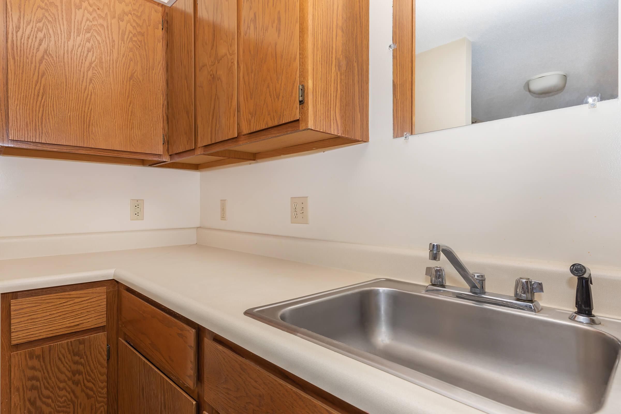 a kitchen with a sink and a microwave