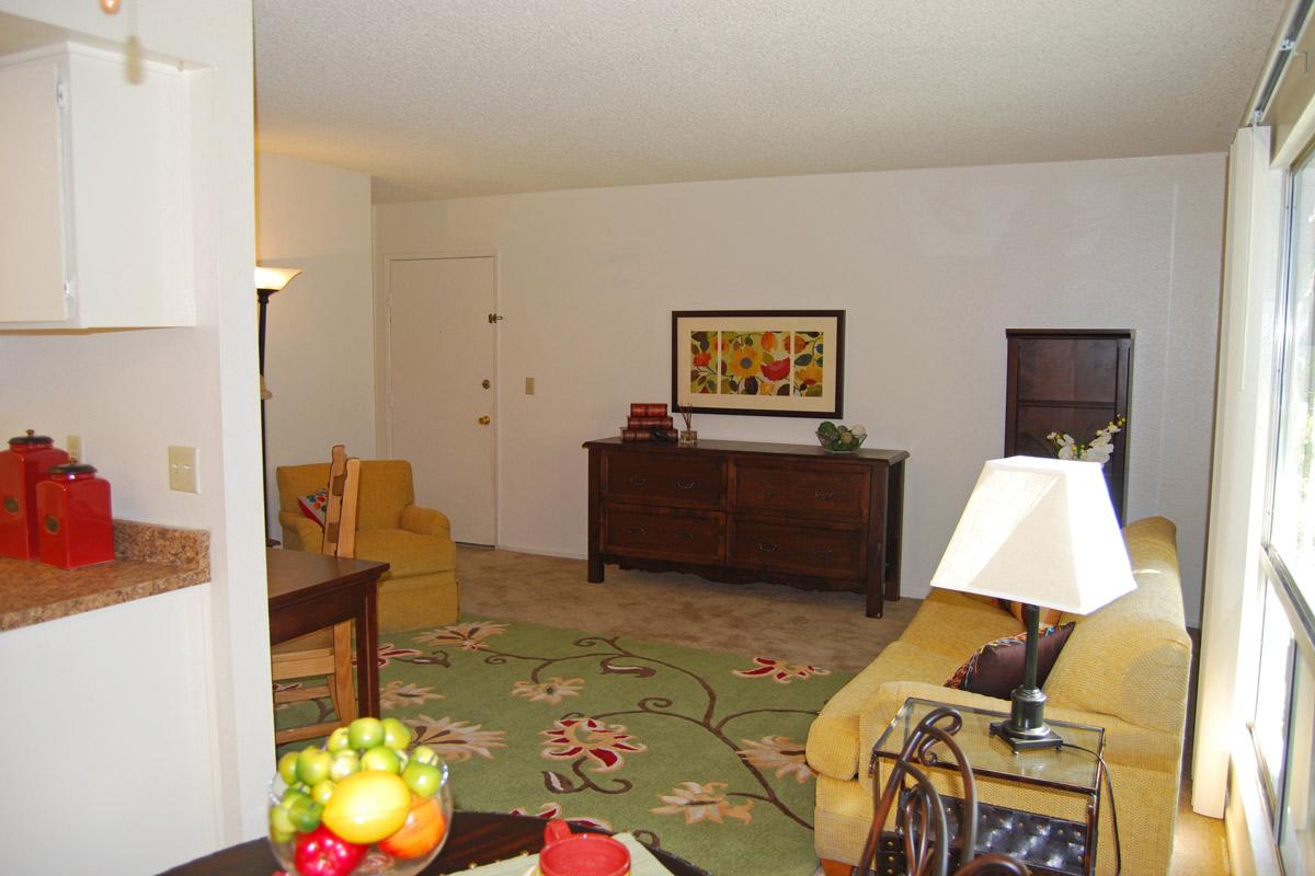 a living room filled with furniture and a table