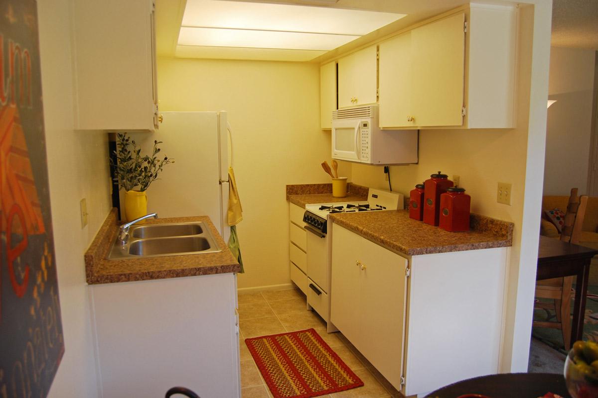 a kitchen with a sink and a refrigerator