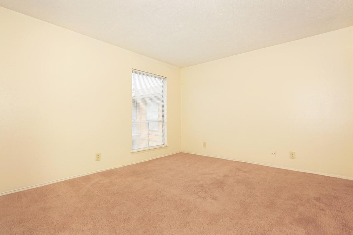 a bedroom with a bed in a room