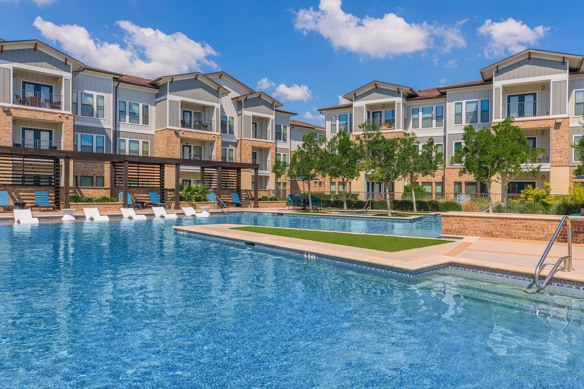 a large pool of water in front of a building