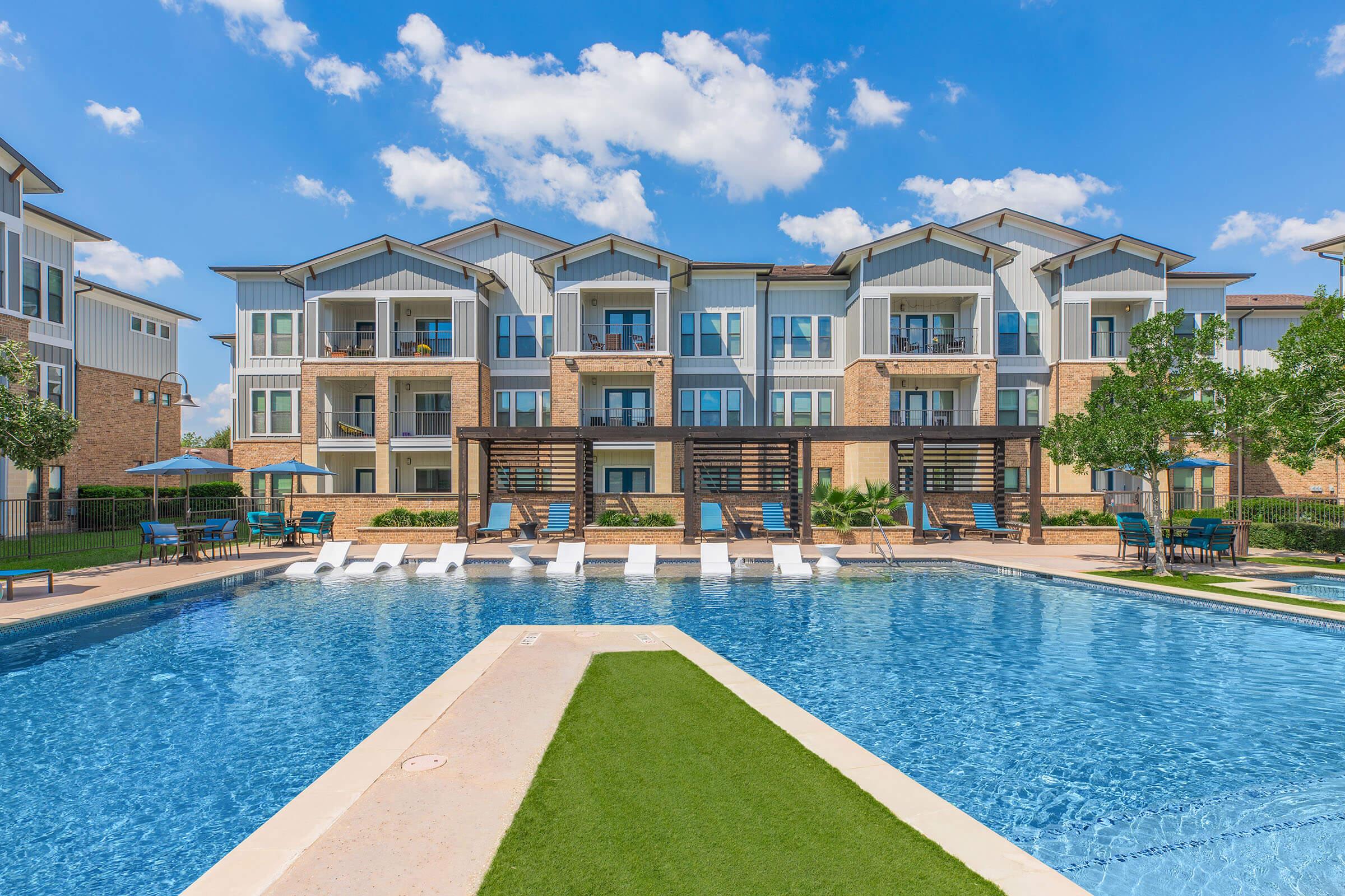 a large pool of water in front of a building