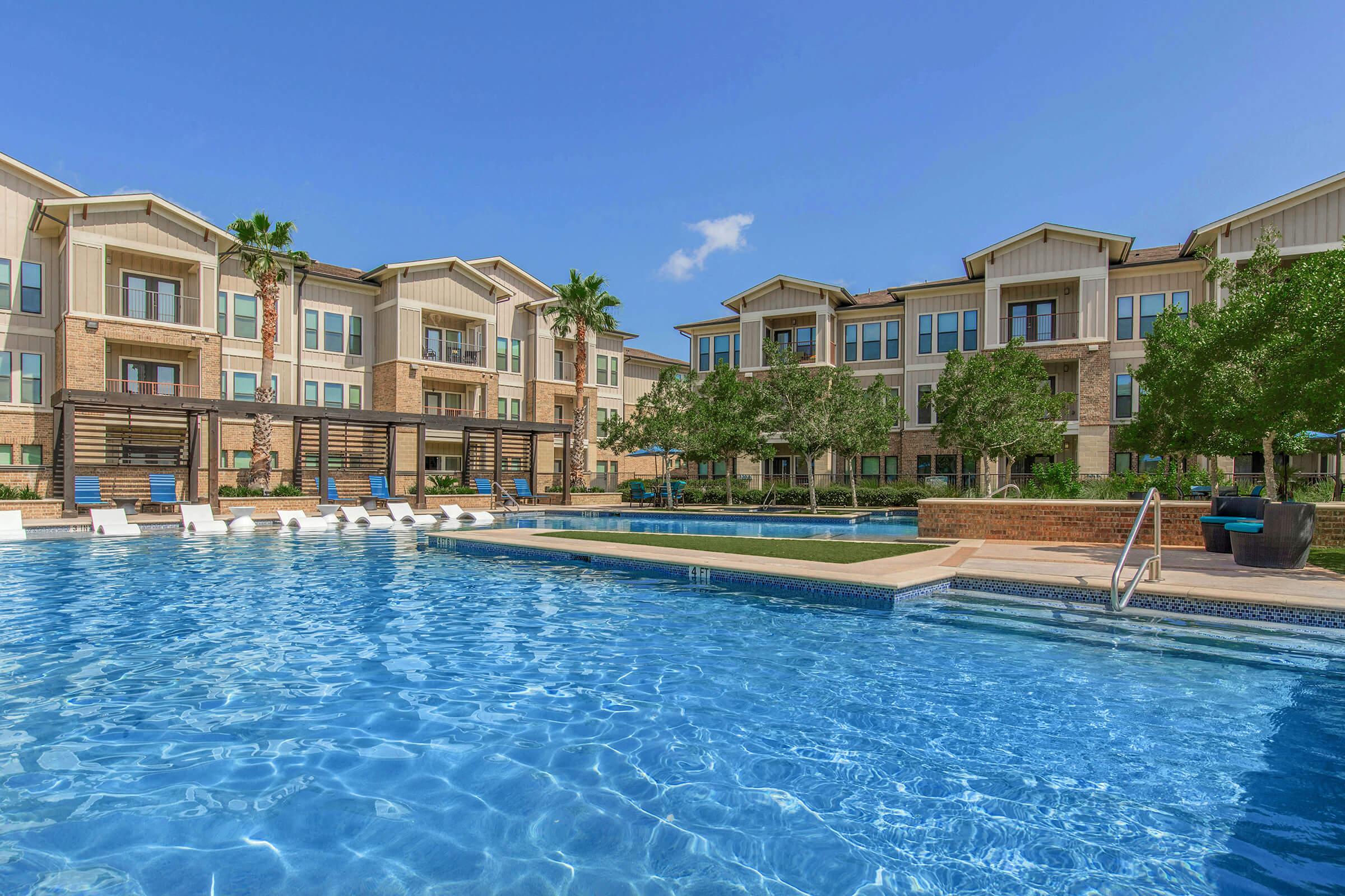 a large pool of water in front of a building