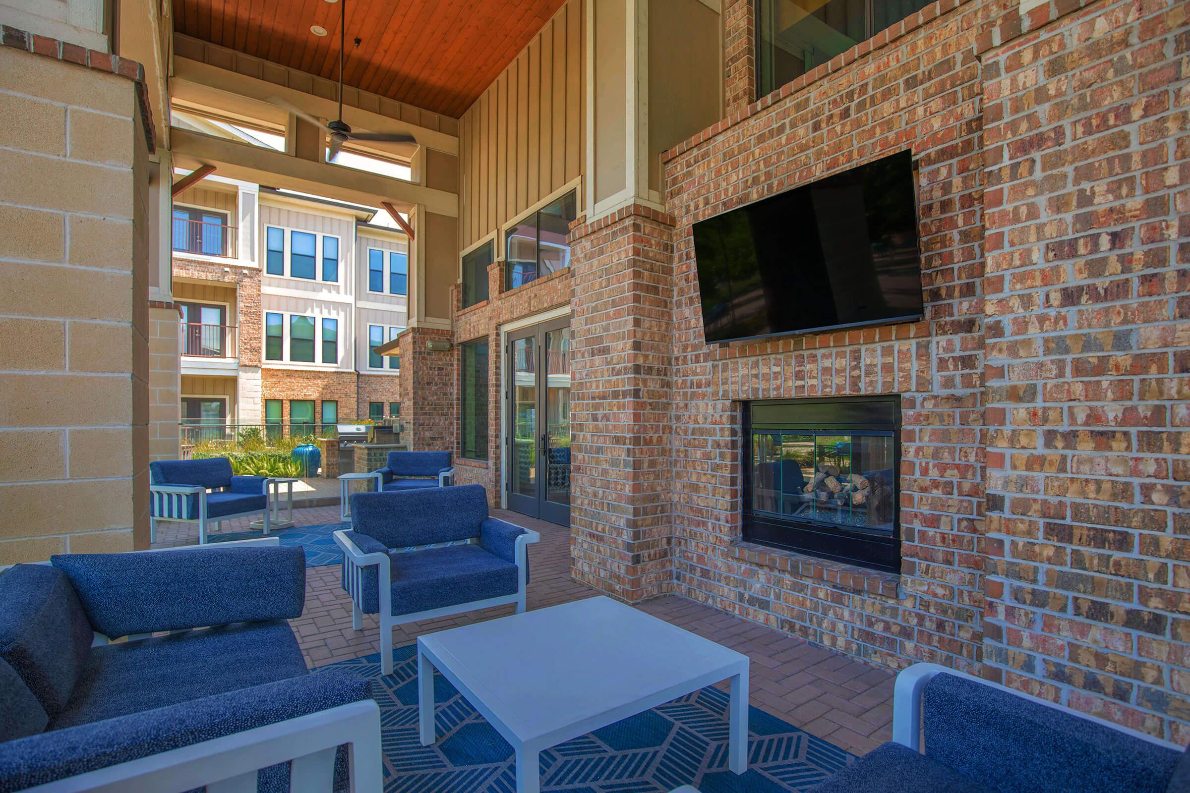 a living room with a brick building