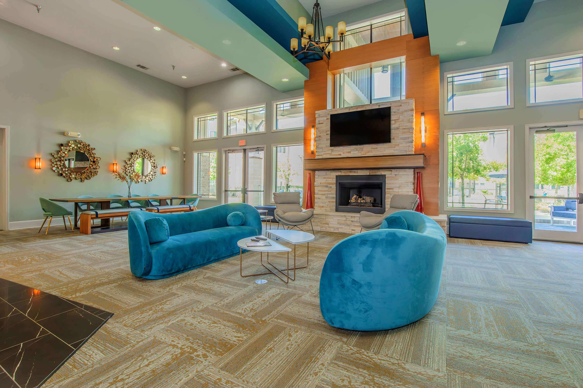 a living room with blue walls and a large window