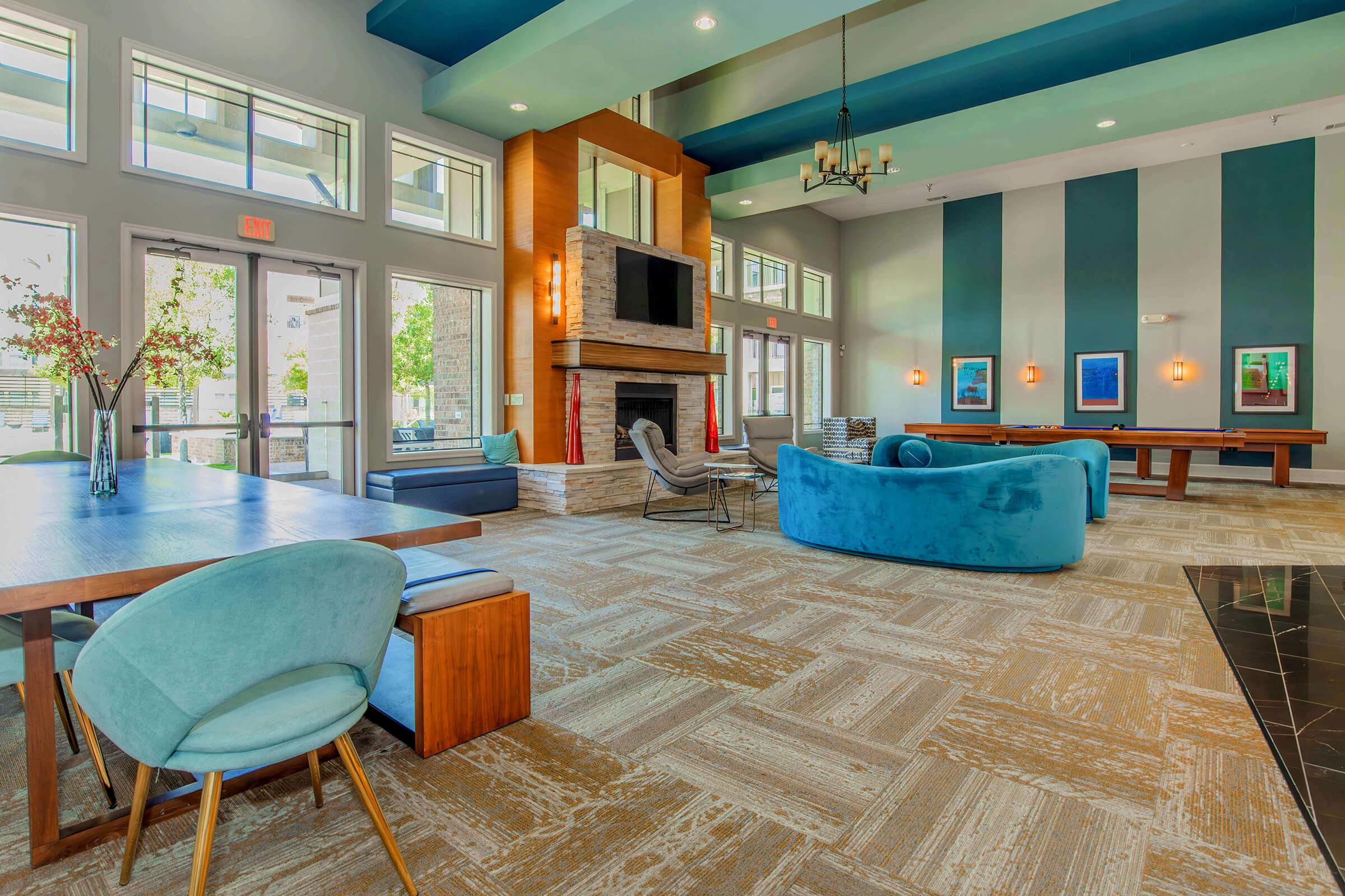 a room filled with furniture and a blue chair