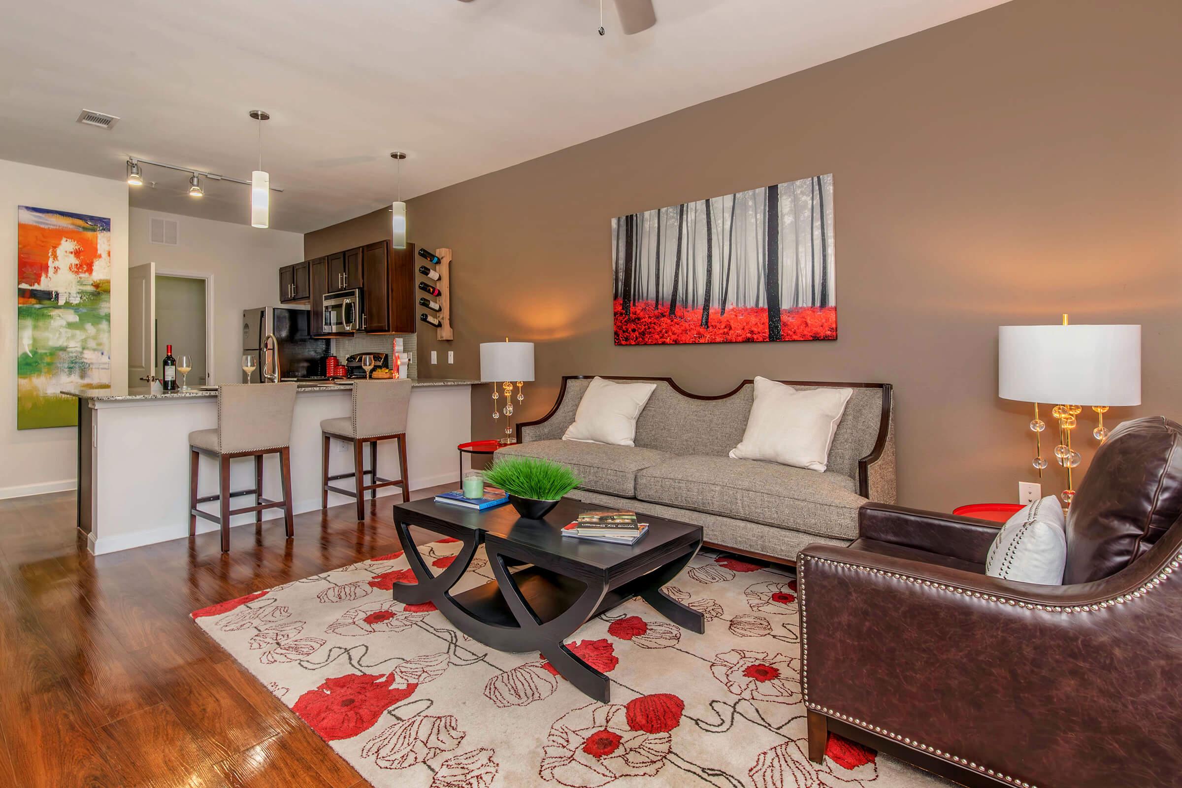 a living room filled with furniture and a flat screen tv