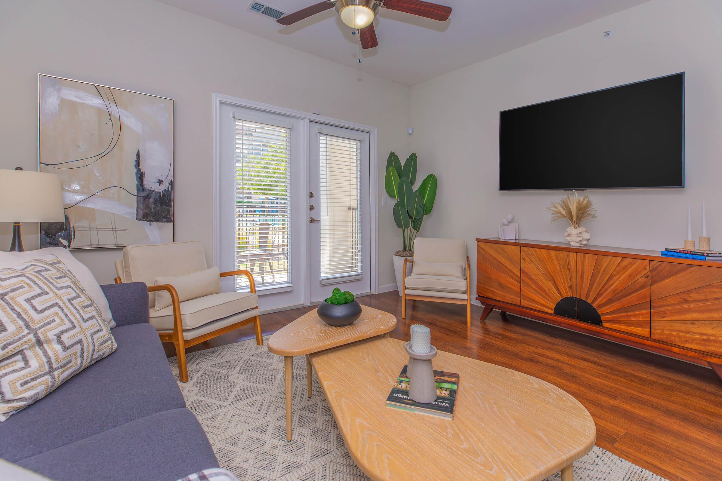 a living room filled with furniture and a fire place