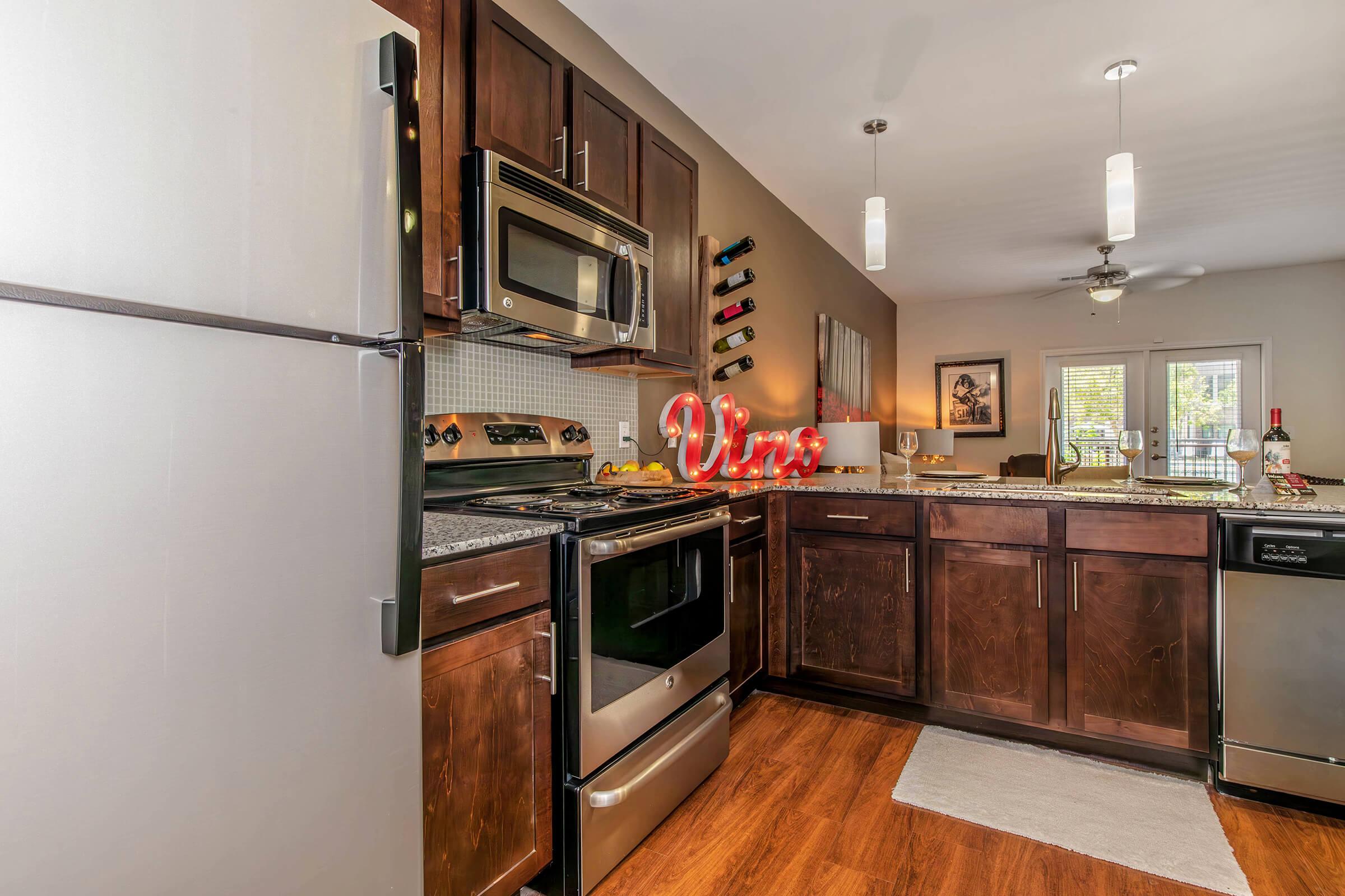 a kitchen with a stove top oven sitting inside of a refrigerator