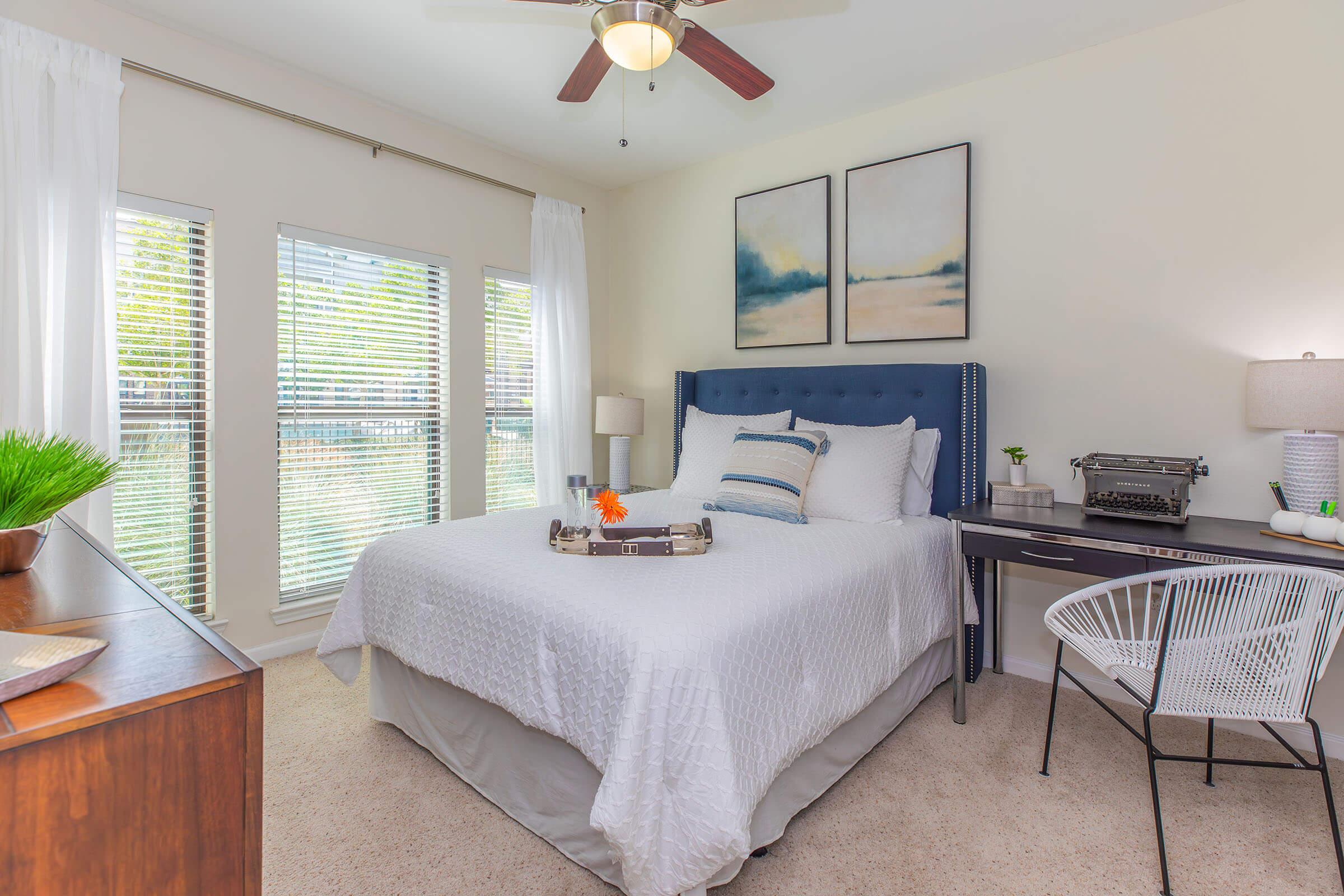 a room filled with furniture and a large window