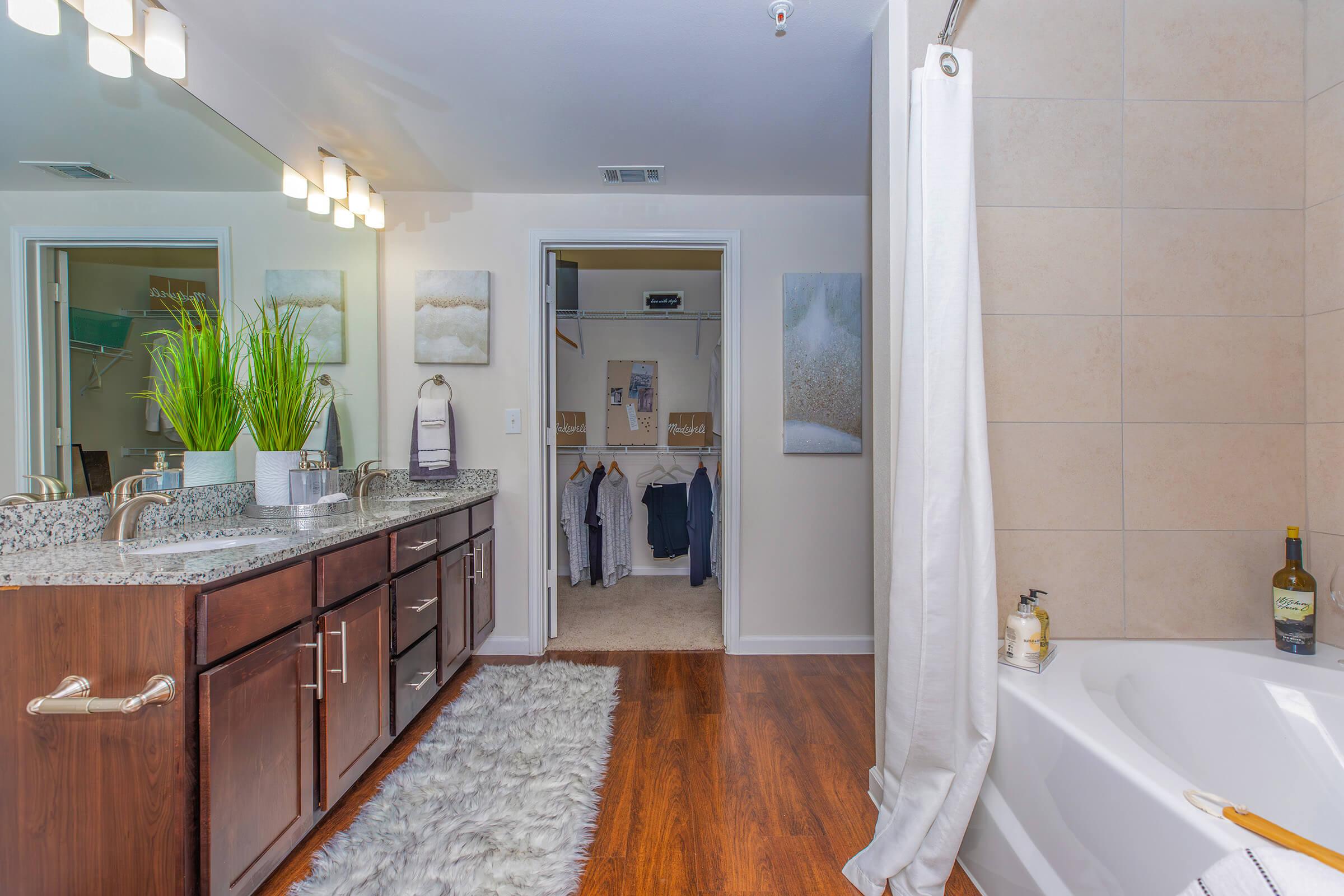 a kitchen with a sink and a mirror