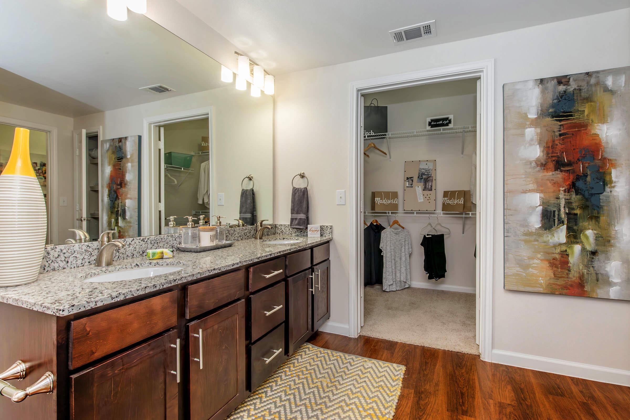 a kitchen with a sink and a mirror