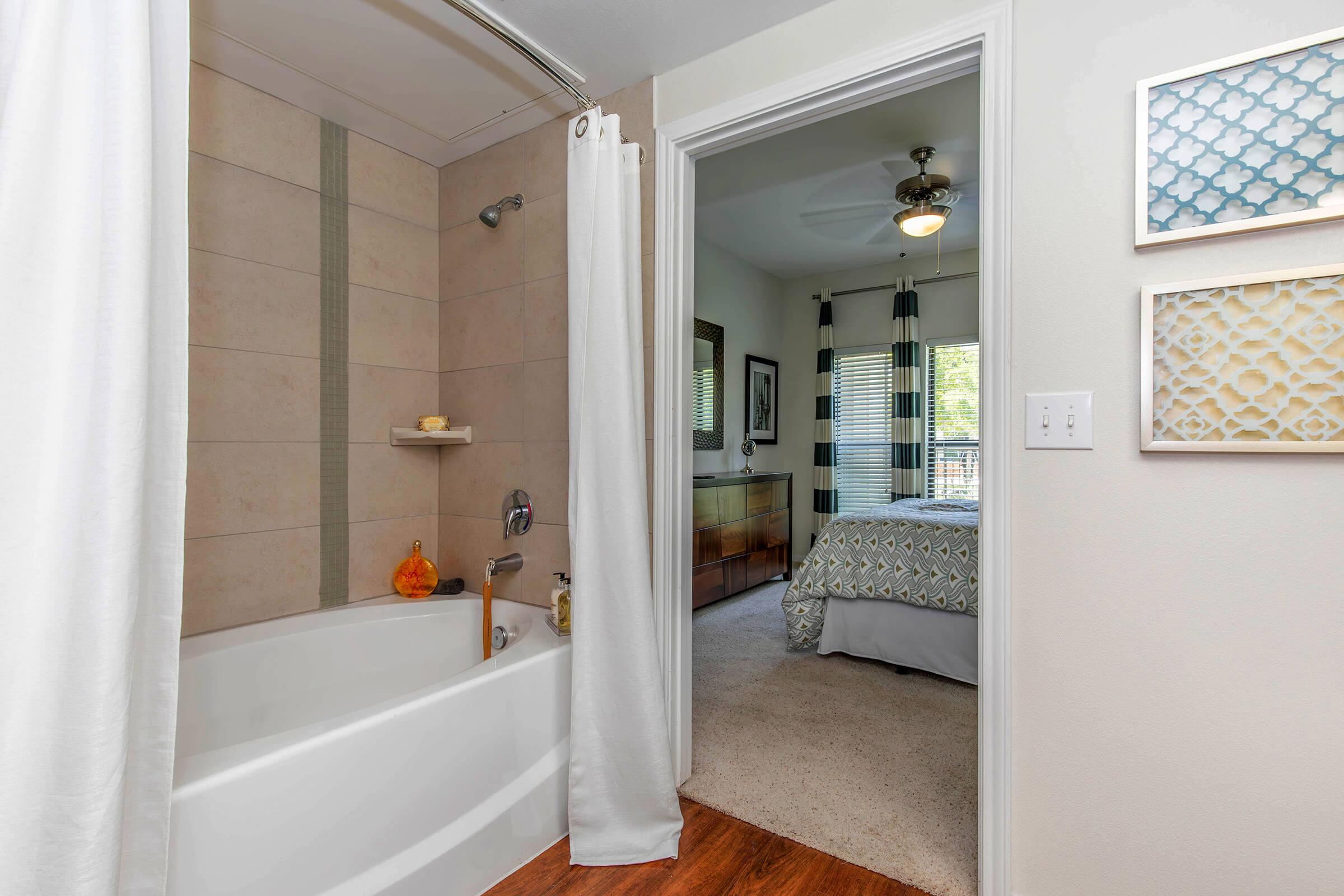 a view of the shower and tub