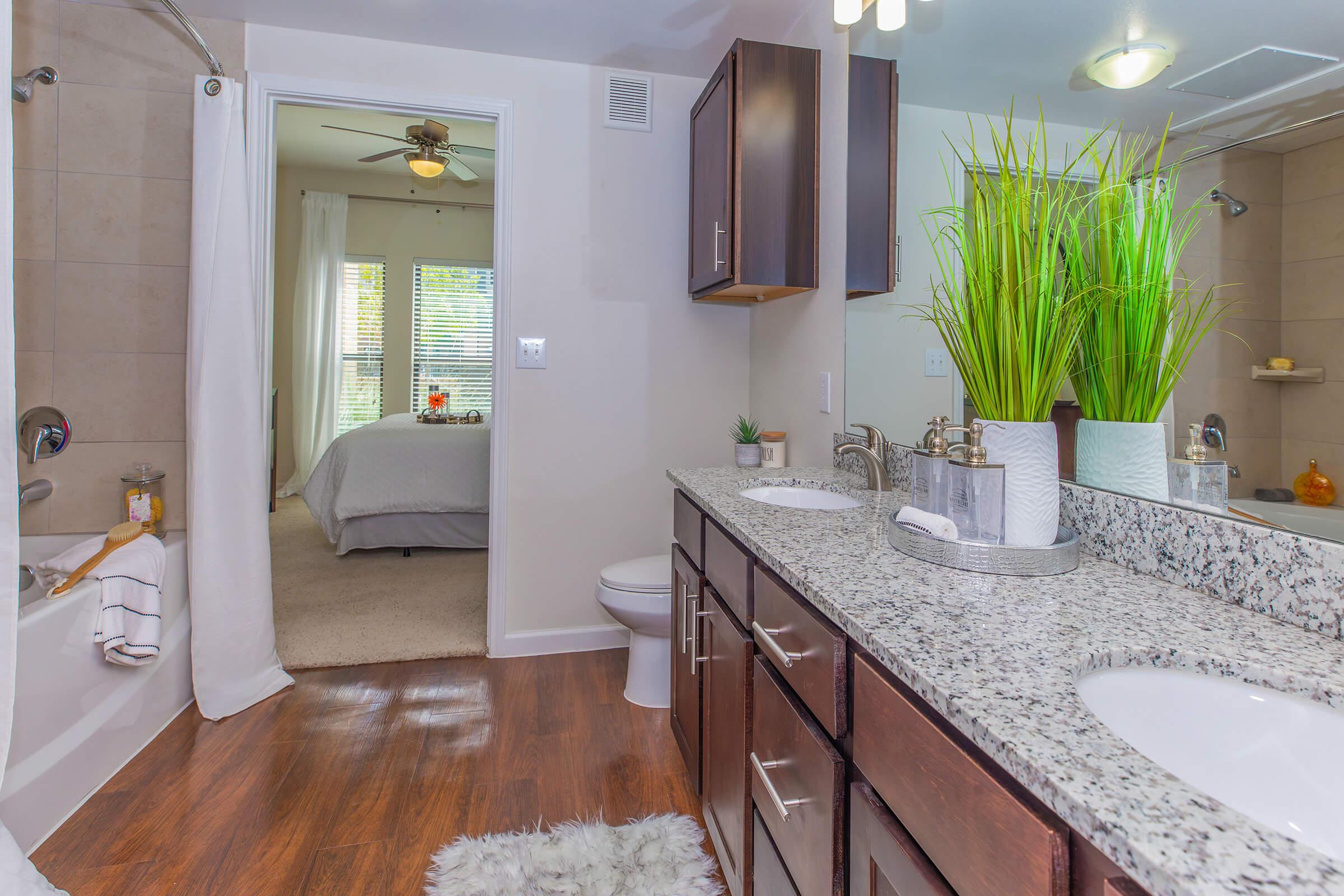 a kitchen with a sink and a mirror