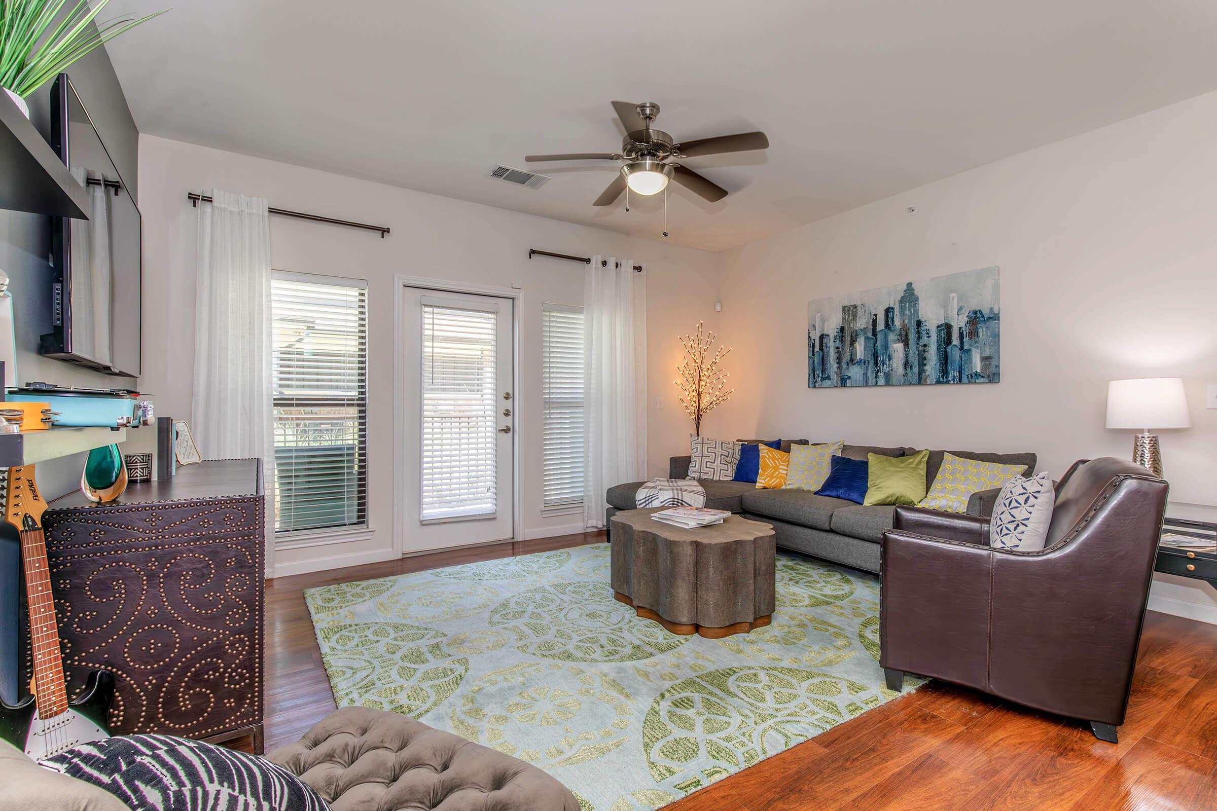 a living room filled with furniture and a fireplace