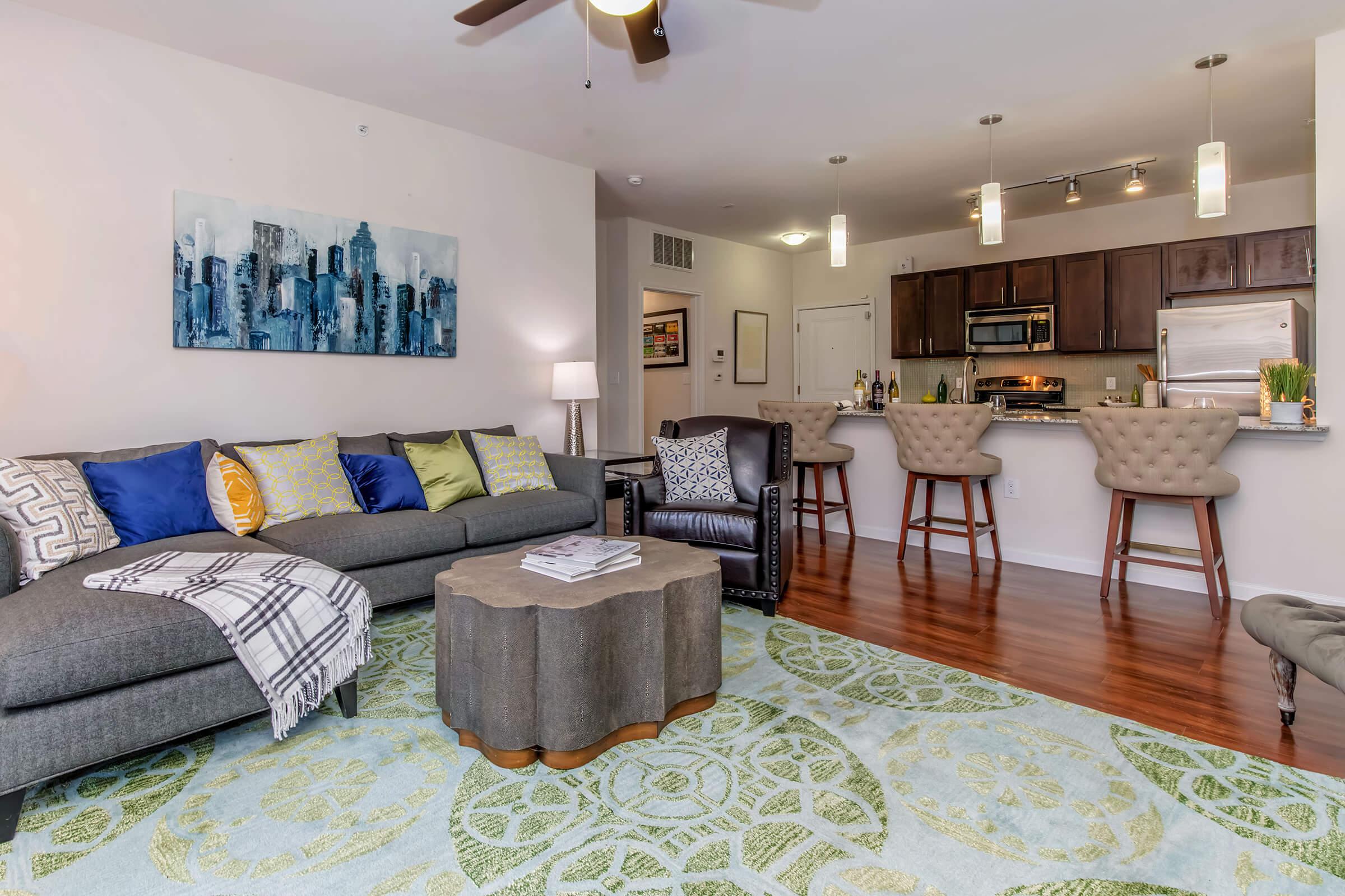 a living room filled with furniture and a rug