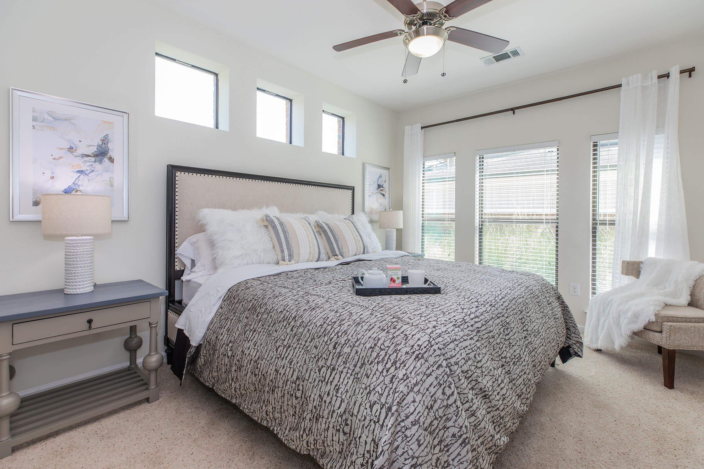 a bedroom with a large bed in a room