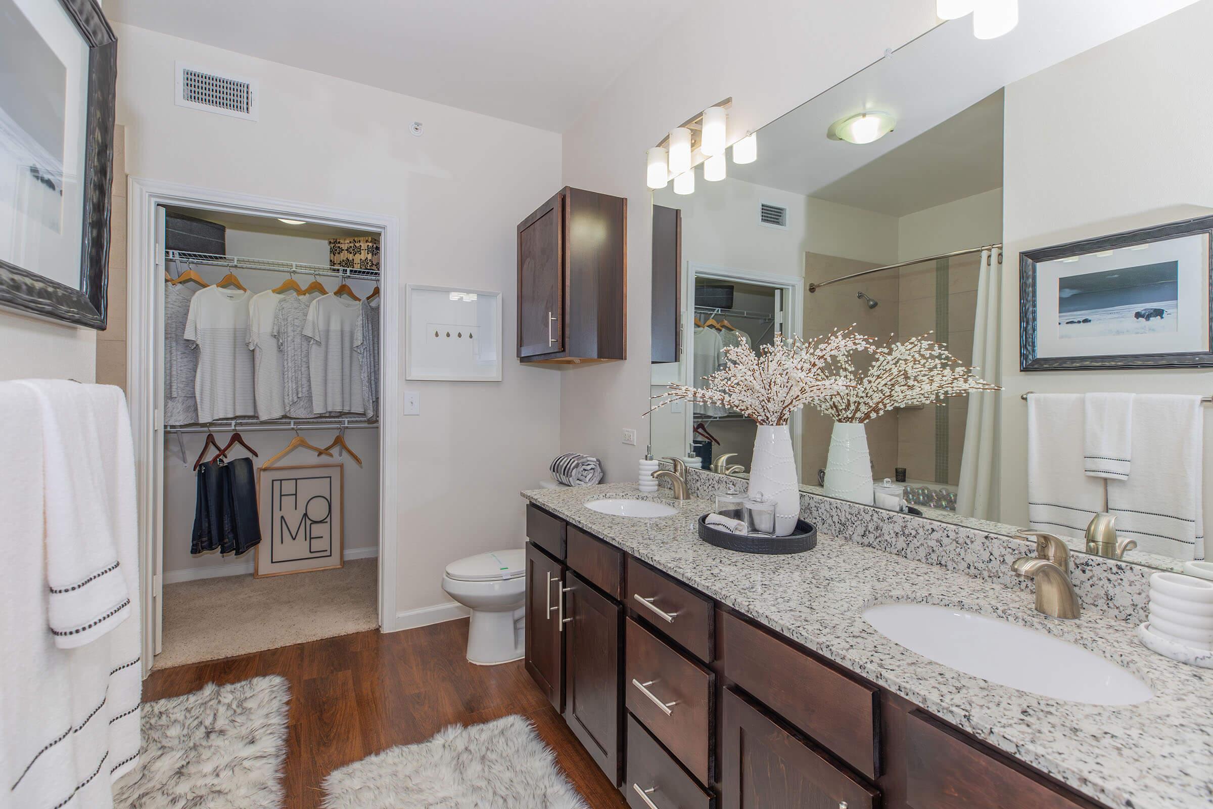 a kitchen with a sink and a mirror