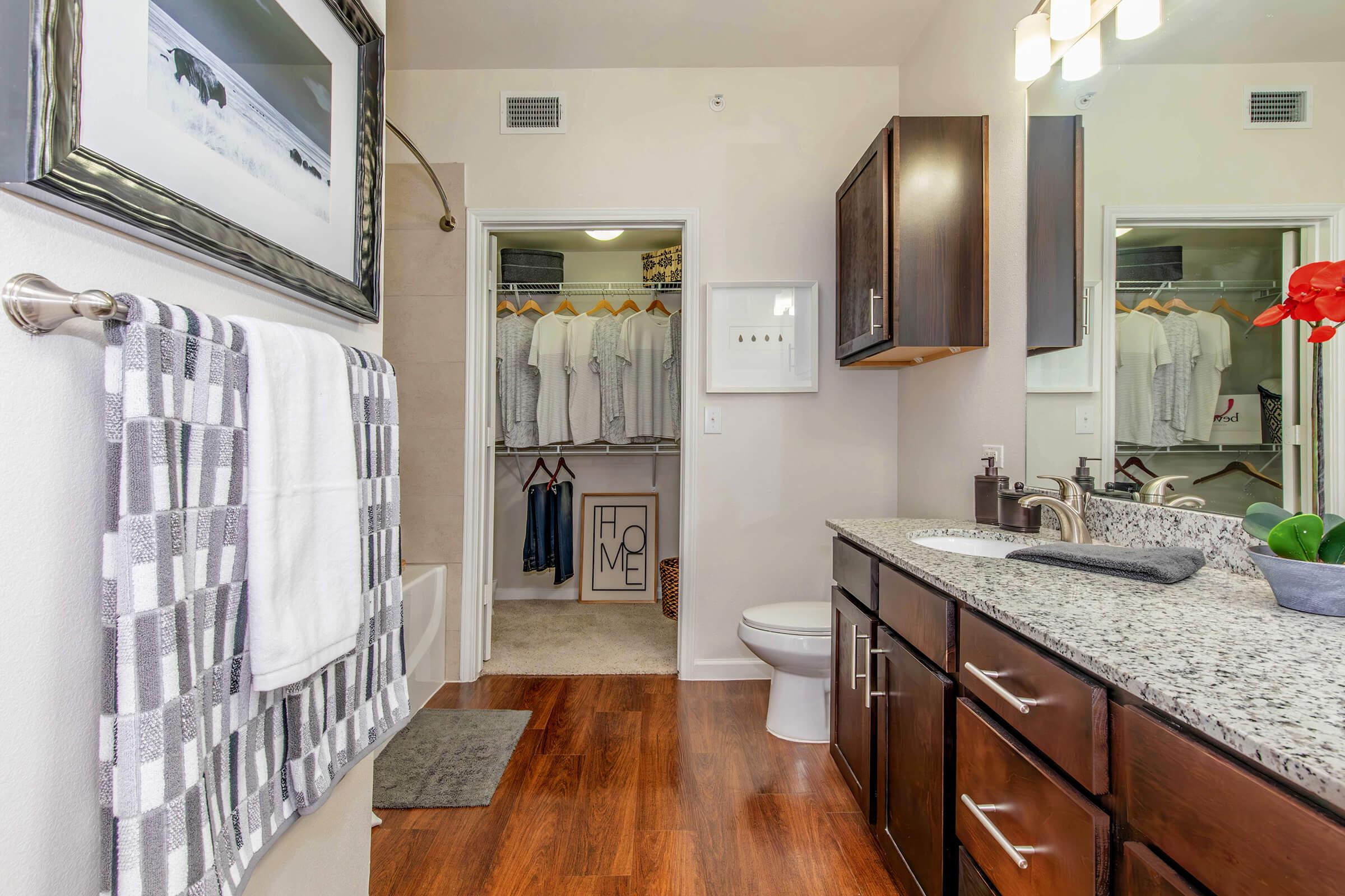 a kitchen with a sink and a mirror