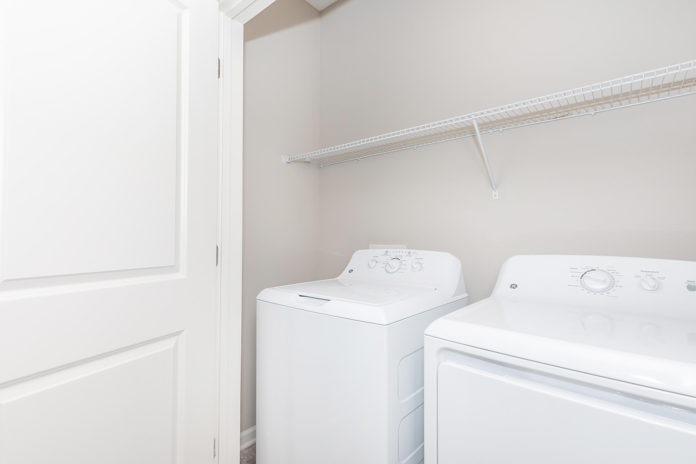 a white refrigerator freezer sitting in a room