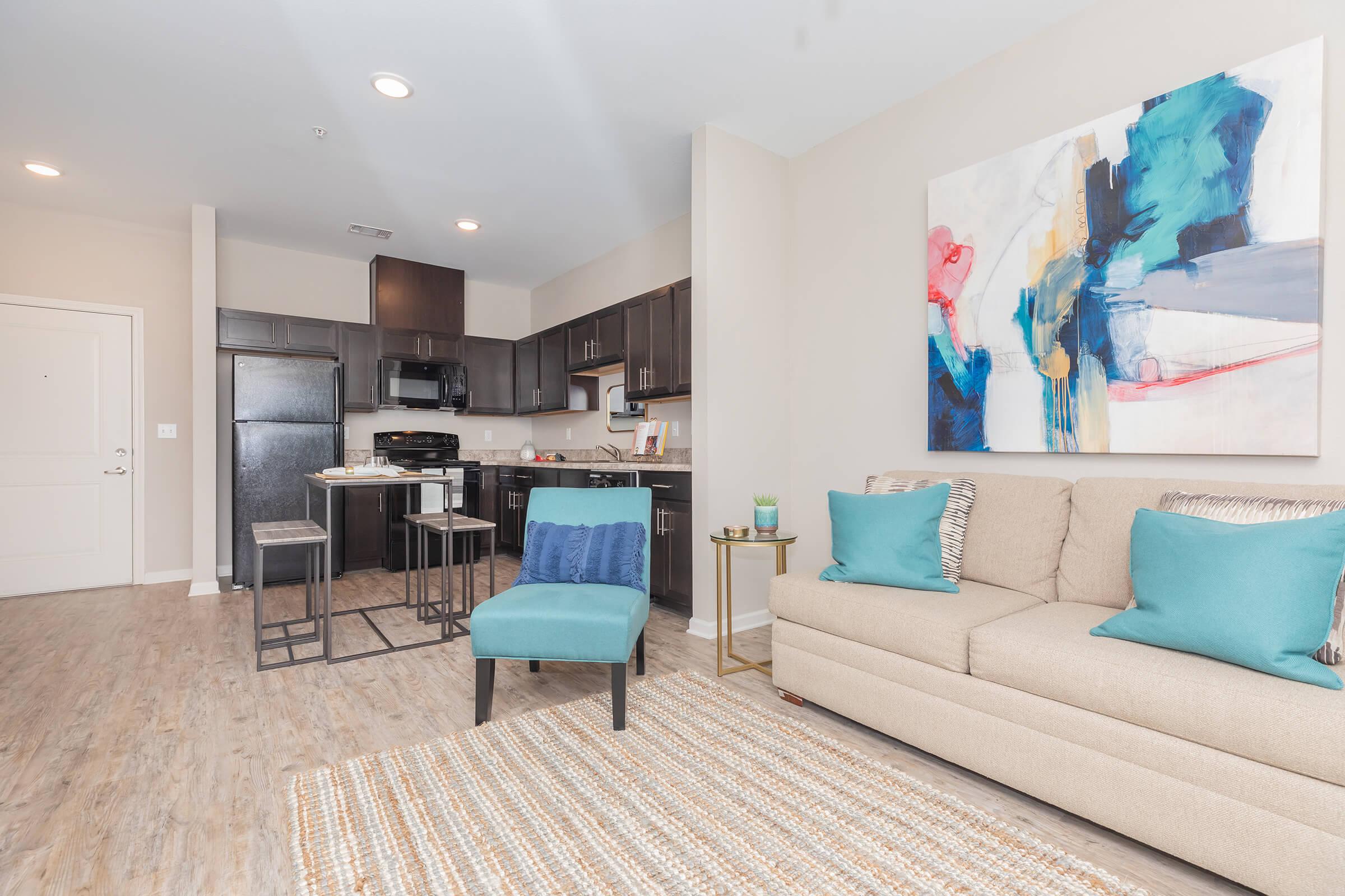 a living room filled with furniture and a rug