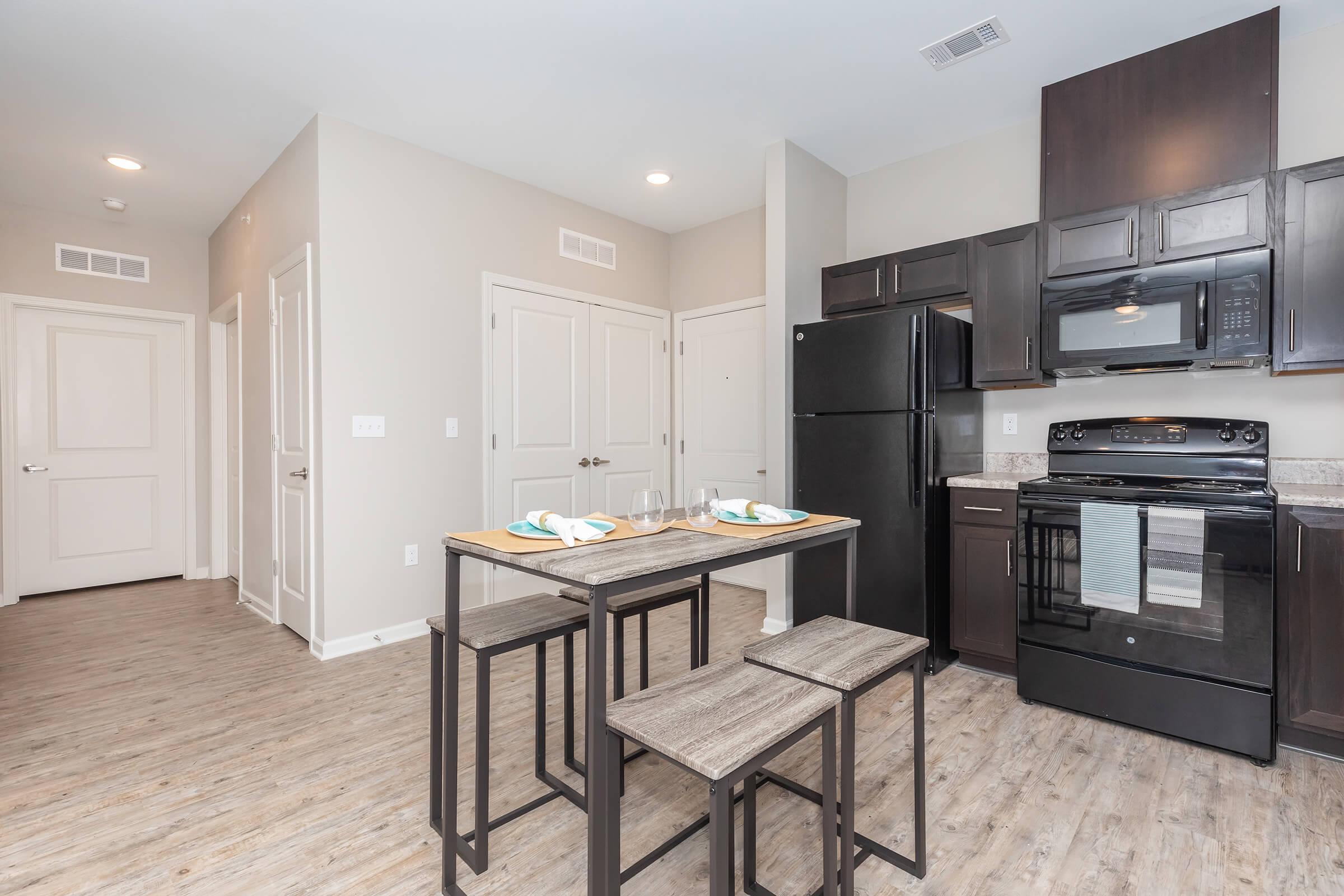 a large kitchen with stainless steel appliances