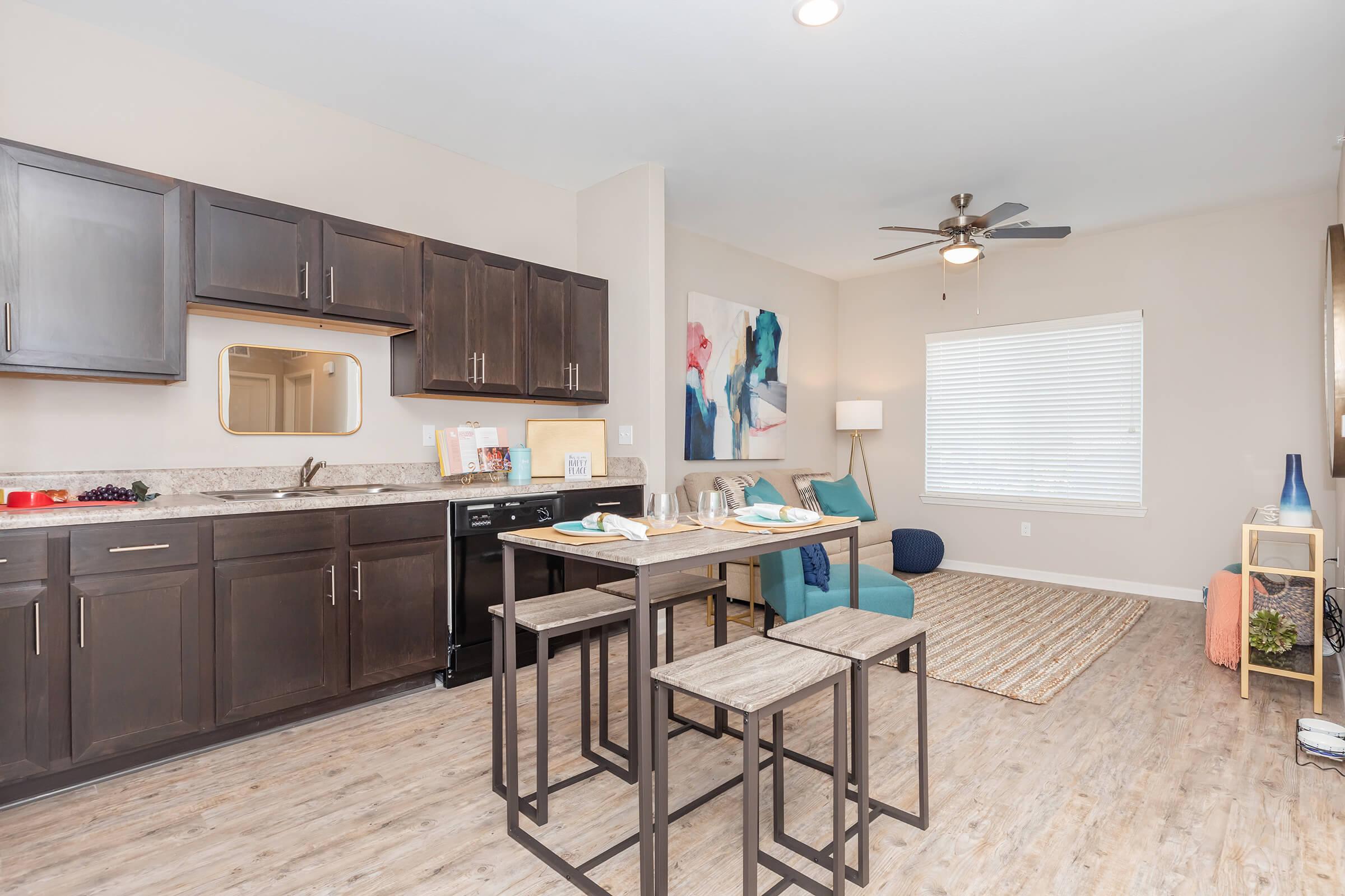 a kitchen with an island in the middle of a room