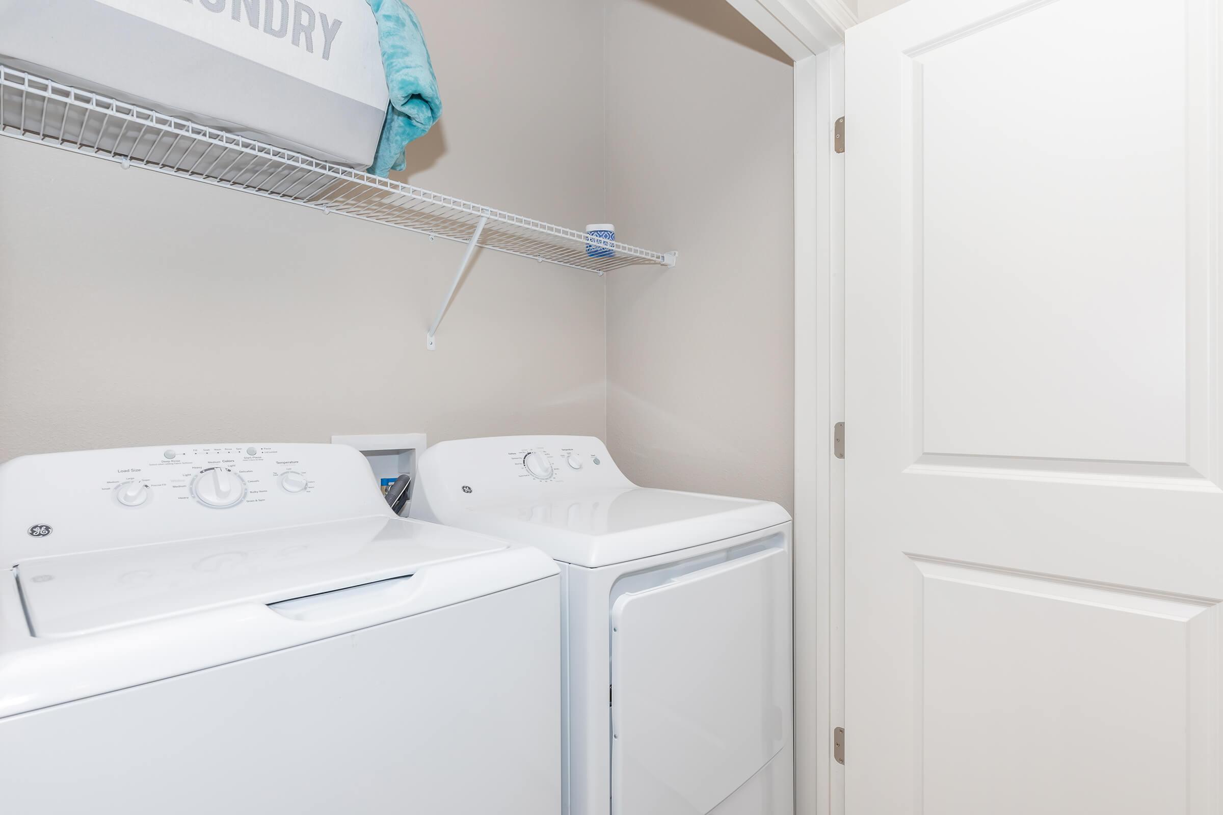 a white refrigerator freezer sitting in a room