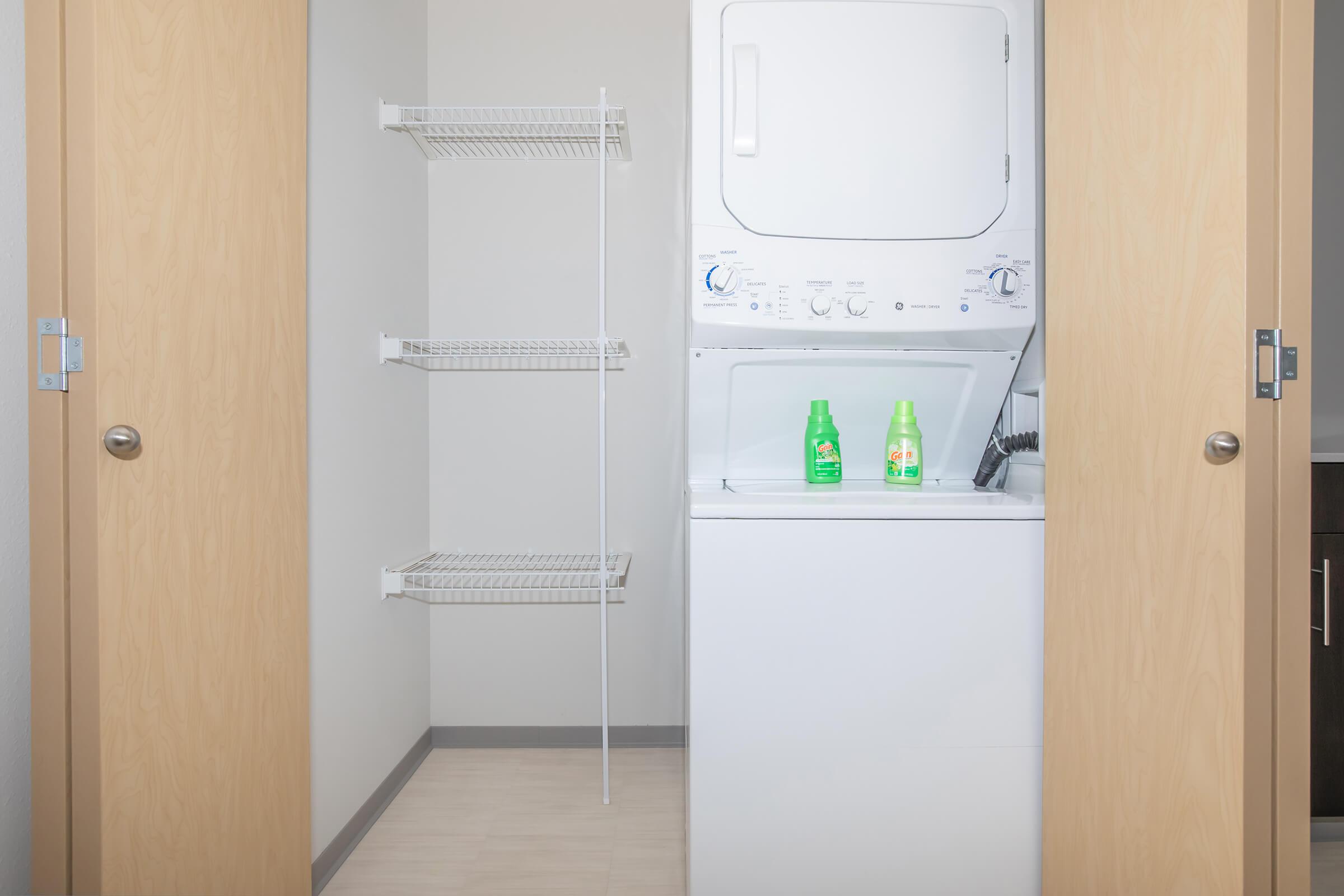 a white refrigerator freezer sitting next to a door